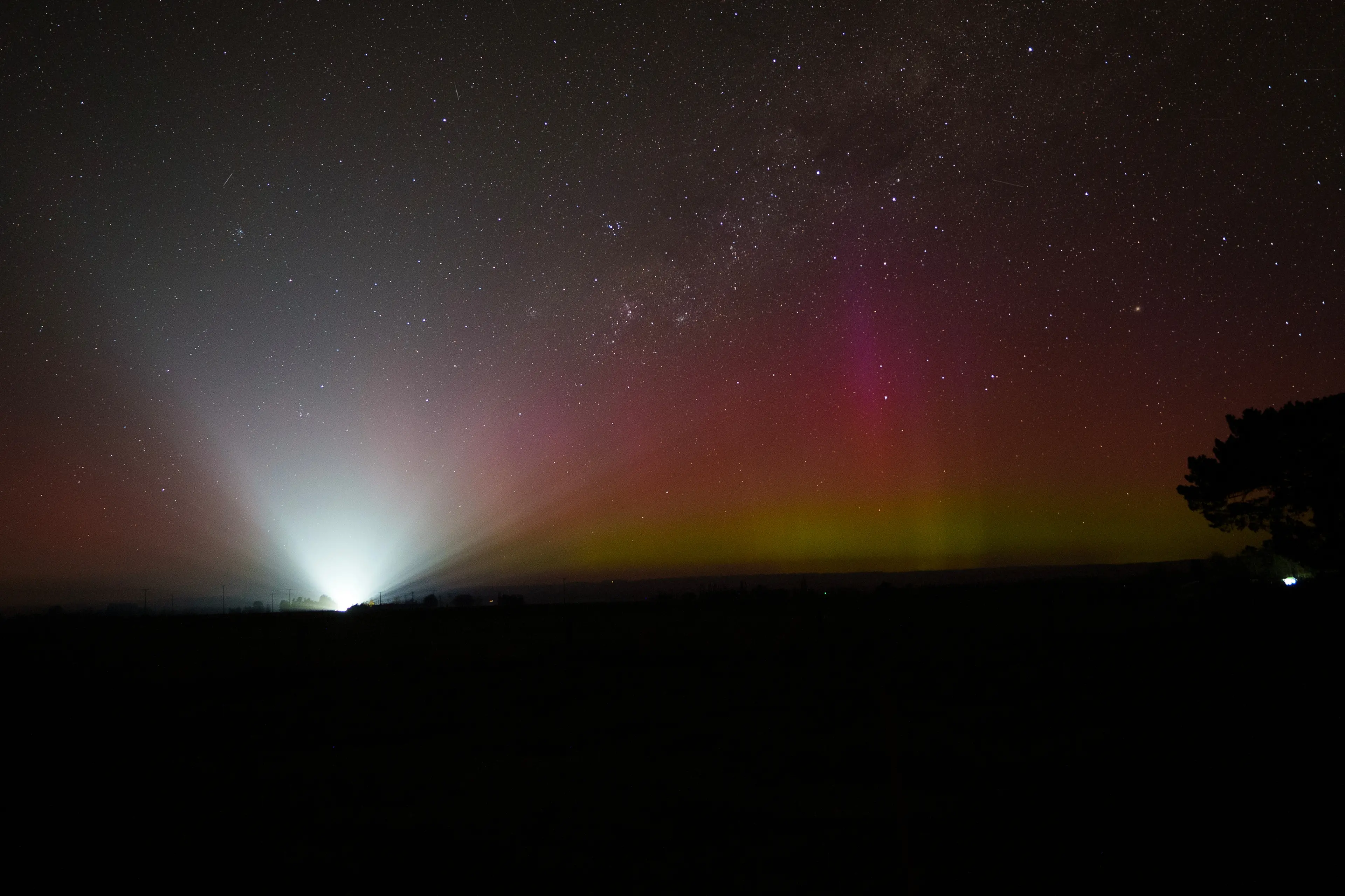 An approaching ute rather interrupts the view of an aurora in Middlemarch. Photo: Ian Griffin