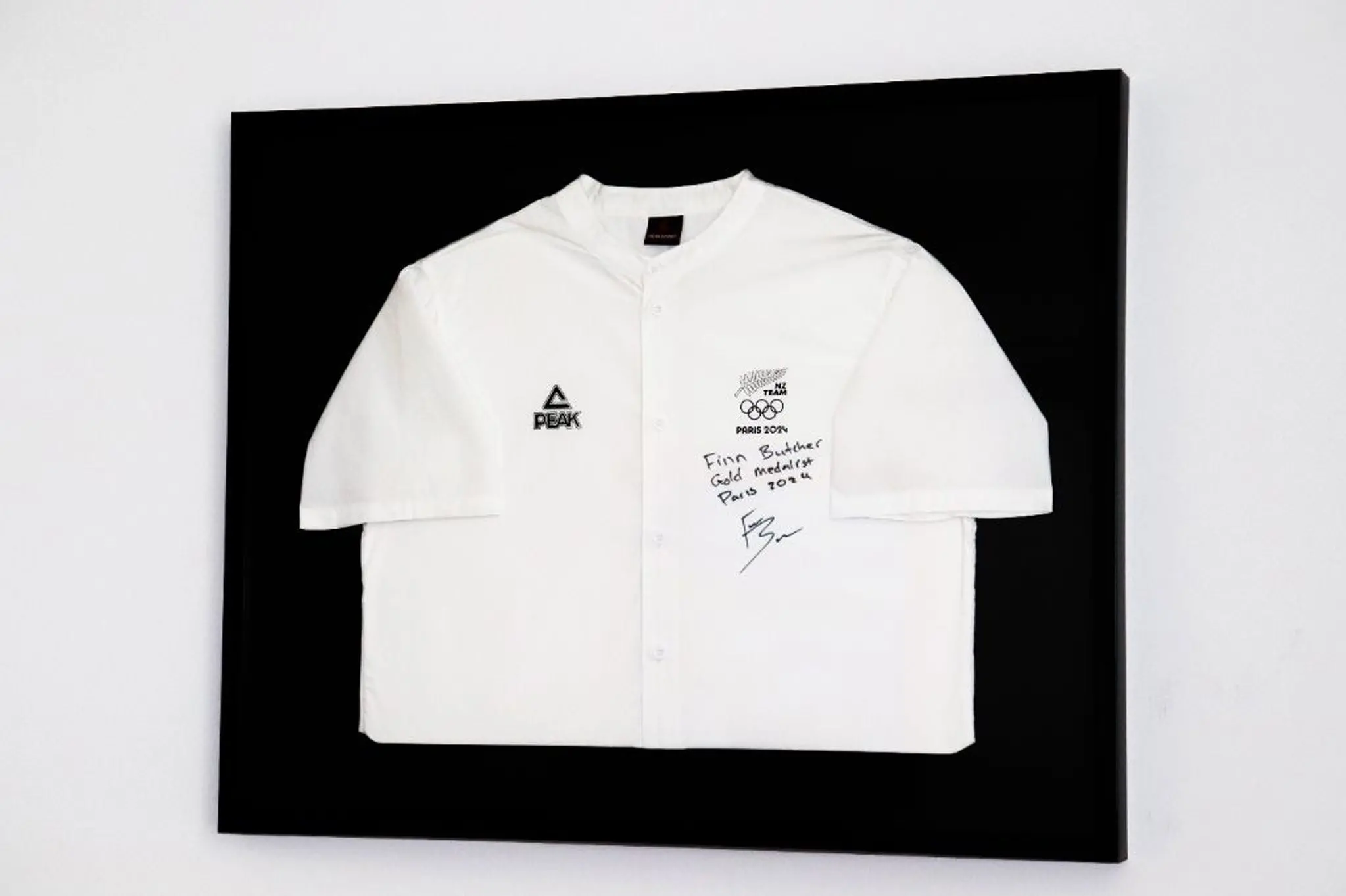 Alexandra kayaker Finn Butcher\\'s signed Paris 2024 Olympic team shirt is one of two Olympic items to be auctioned at the annual Pioneer Energy Central Otago Dinner Club and on Trade Me for those that missed tickets to the event.\\nA training snowboard from Wanaka athlete Zoi Sadowski-Synnott would also be auctioned. Photo: Supplied