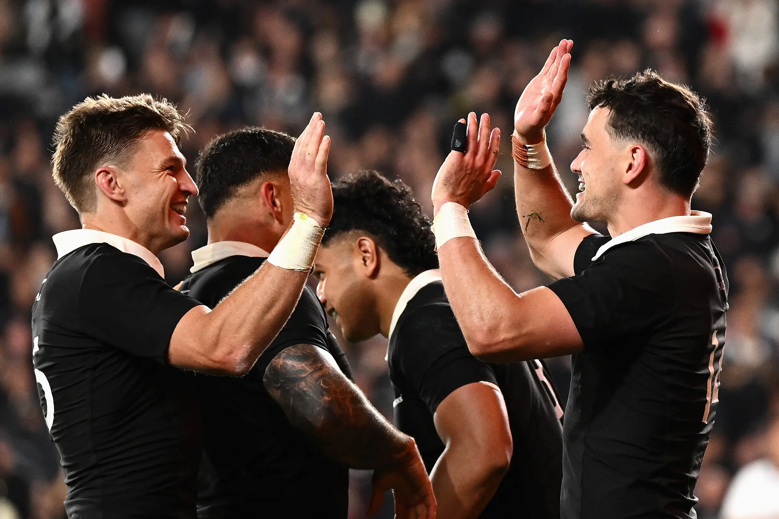 Beauden Barrett (left) congratulates Will Jordan for his try against the Wallabies at Eden Park on Saturday. Photo: Getty Images
