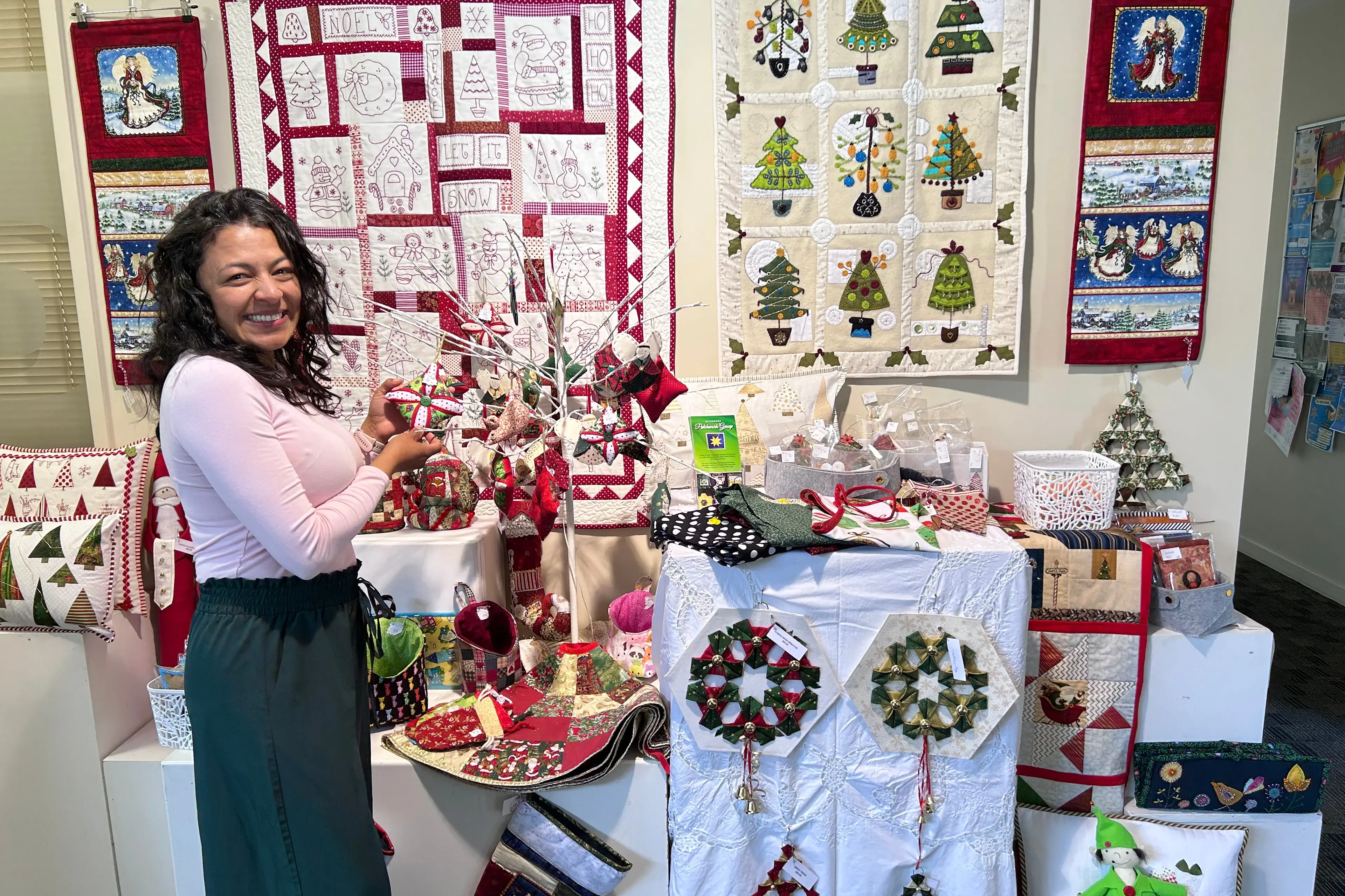 Checking out the Alexandra Patchwork Group\\'s Christmas display is Alejandra Munive, of Alexandra. Photo: Julie Asher