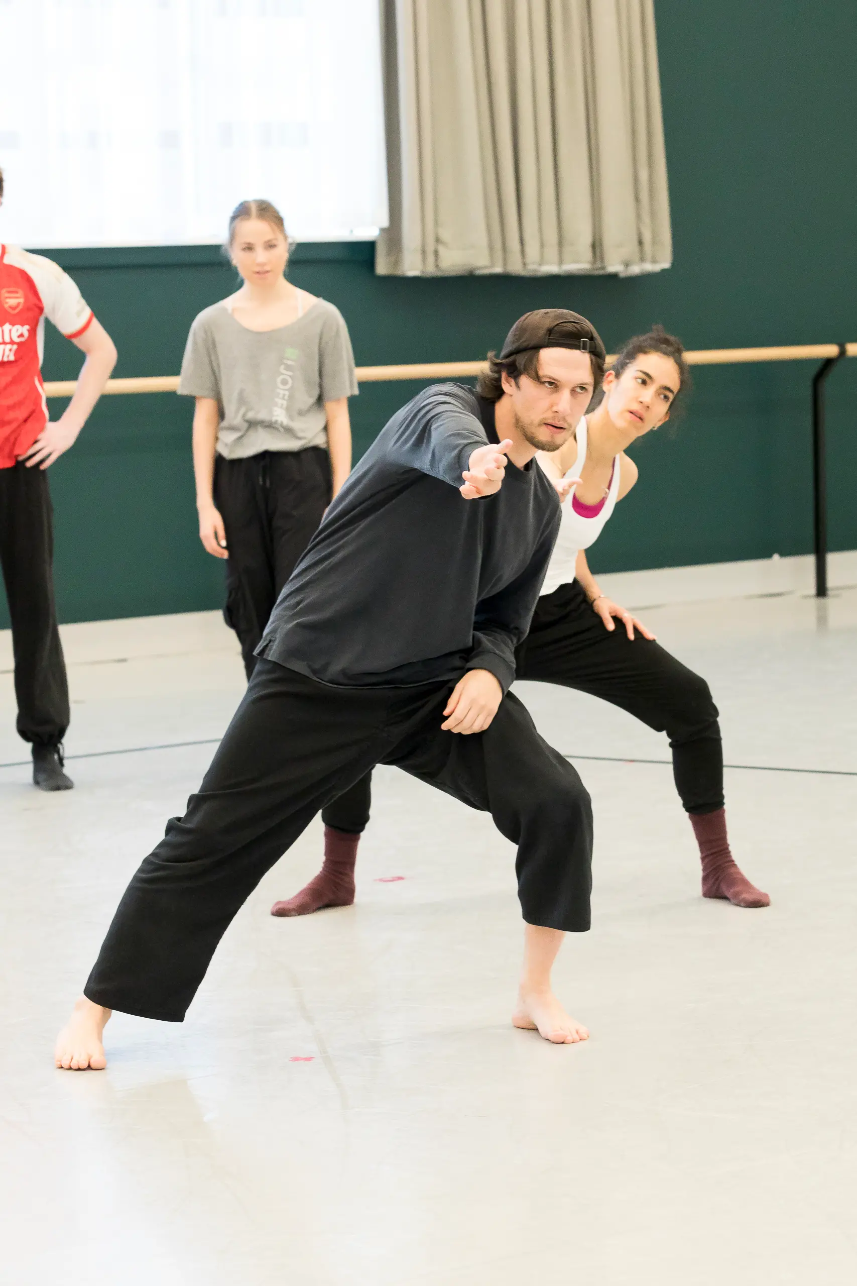 Jeremy Beck works with RNZB principal dancer Ana Gallardo Lobaina and scholar Breyah Takitimu on Soft Reset. Photo:  Celia Walmsley