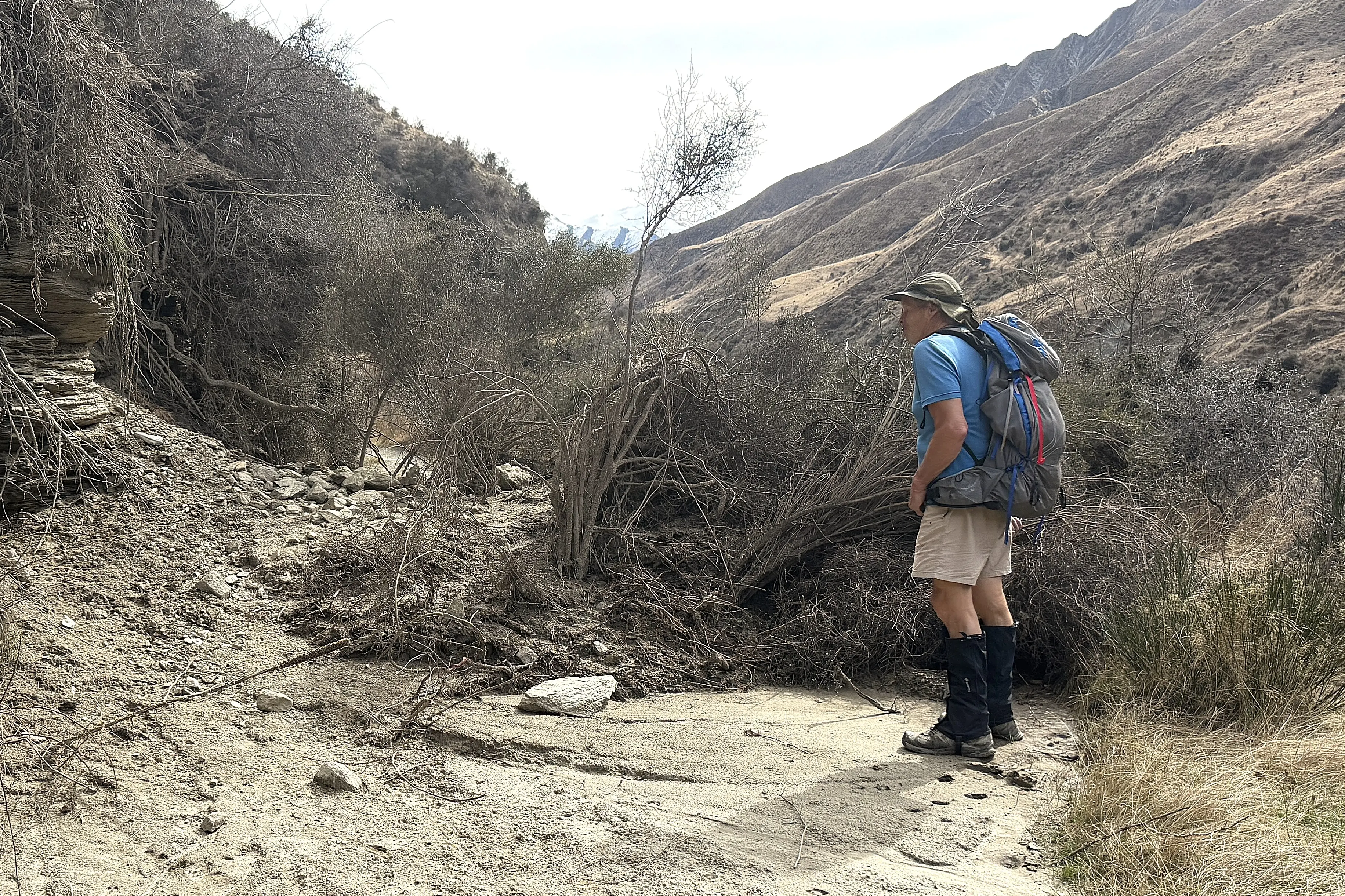 Storm damage: Shotover 4WD Club member Keith Milne checks out a slip on the Macetown road last month. Photo: Kevin Marlow