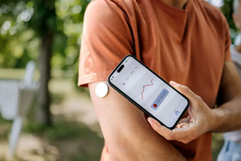 The device is worn on the skin and tracks glucose levels throughout the day and night, sending that information to a receiver, usually a smartphone. Photo: Getty Images