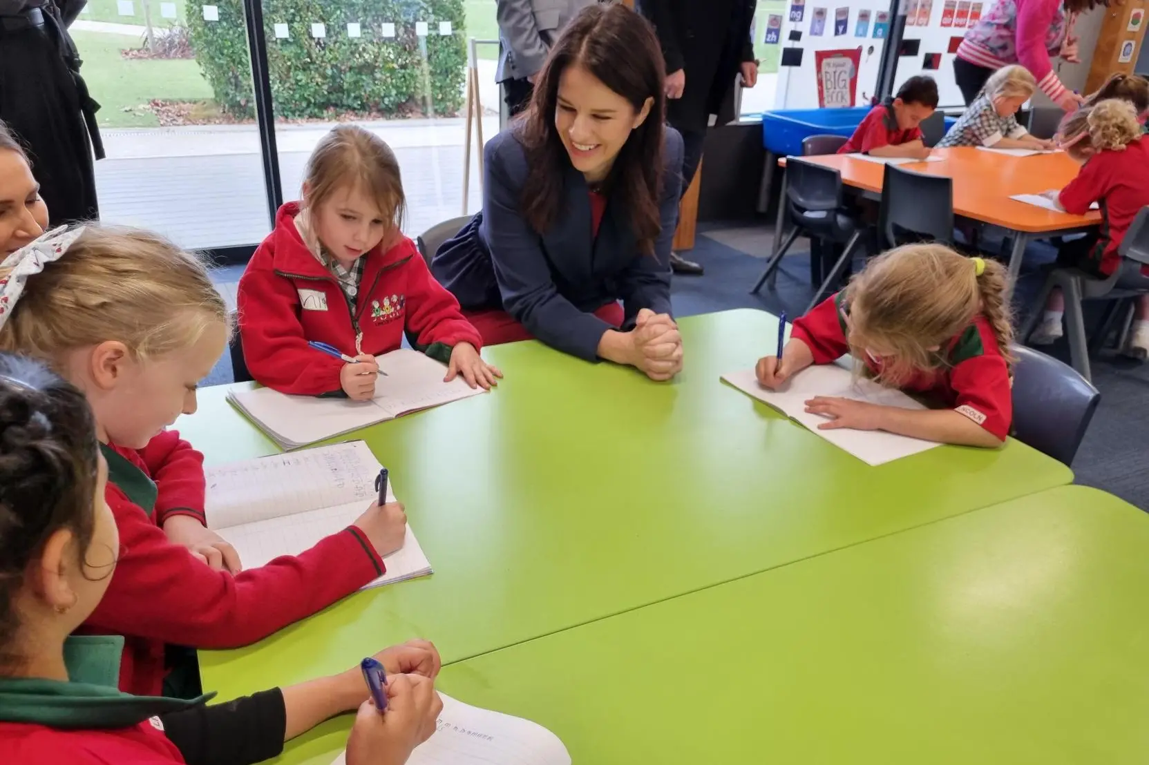 <p>Education Minister Erica Stanford with primary school students in May. Photo: RNZ</p>\\n