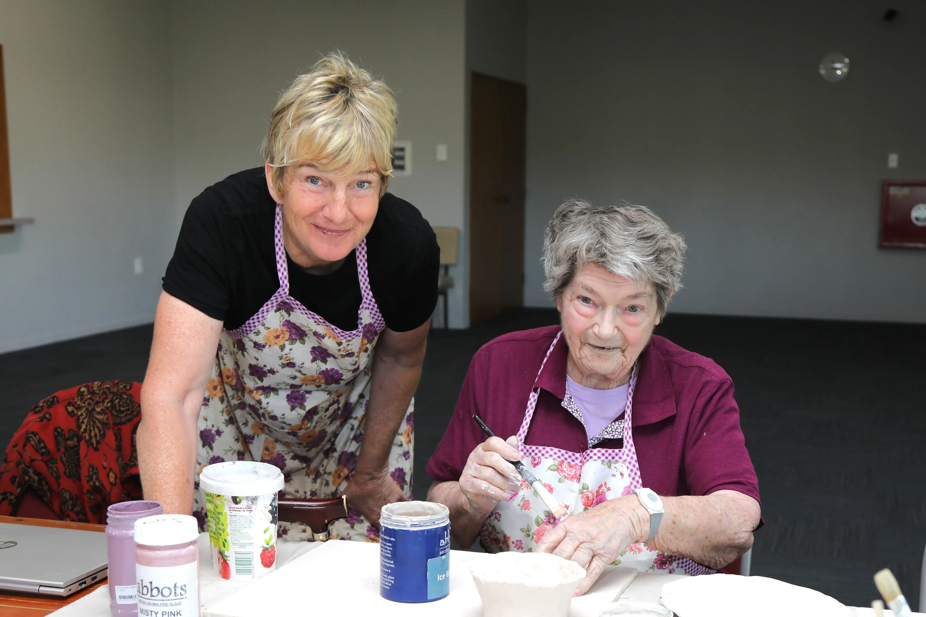 Step Ahead activities co-ordinator Jen Dearborn, at left, using pottery with long time member Janete to create. Photo: Heather Mackenzie