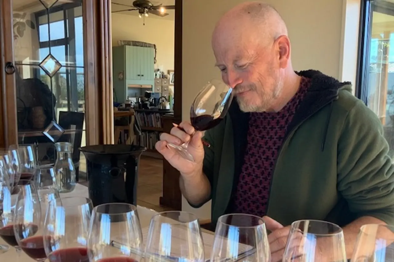 Taste test . . . Olly Masters tastes some wine during judging in the North Canterbury Wine Competition. Photo: Supplied
