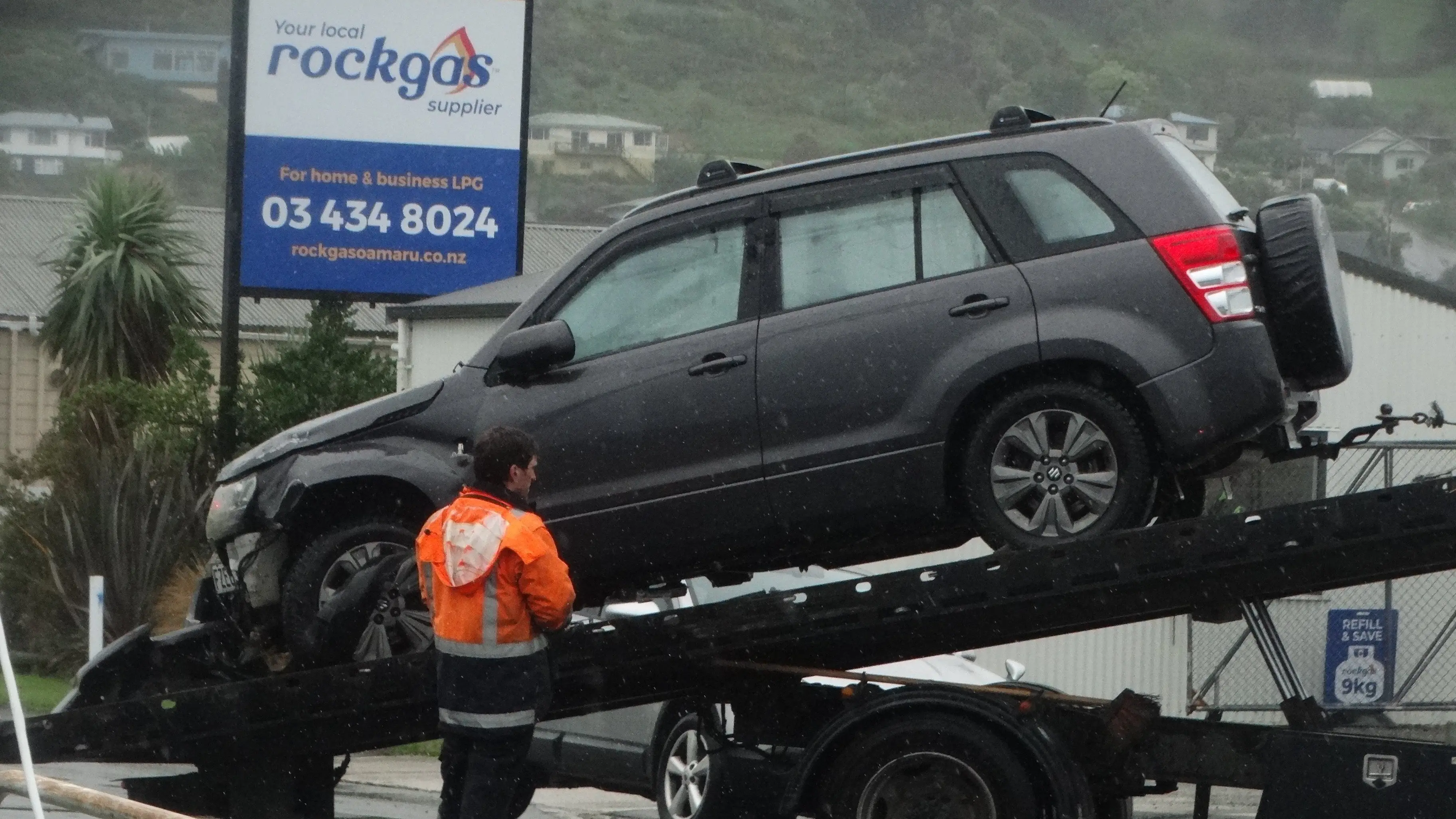 Car rolls, crashes into gate of Oamaru business