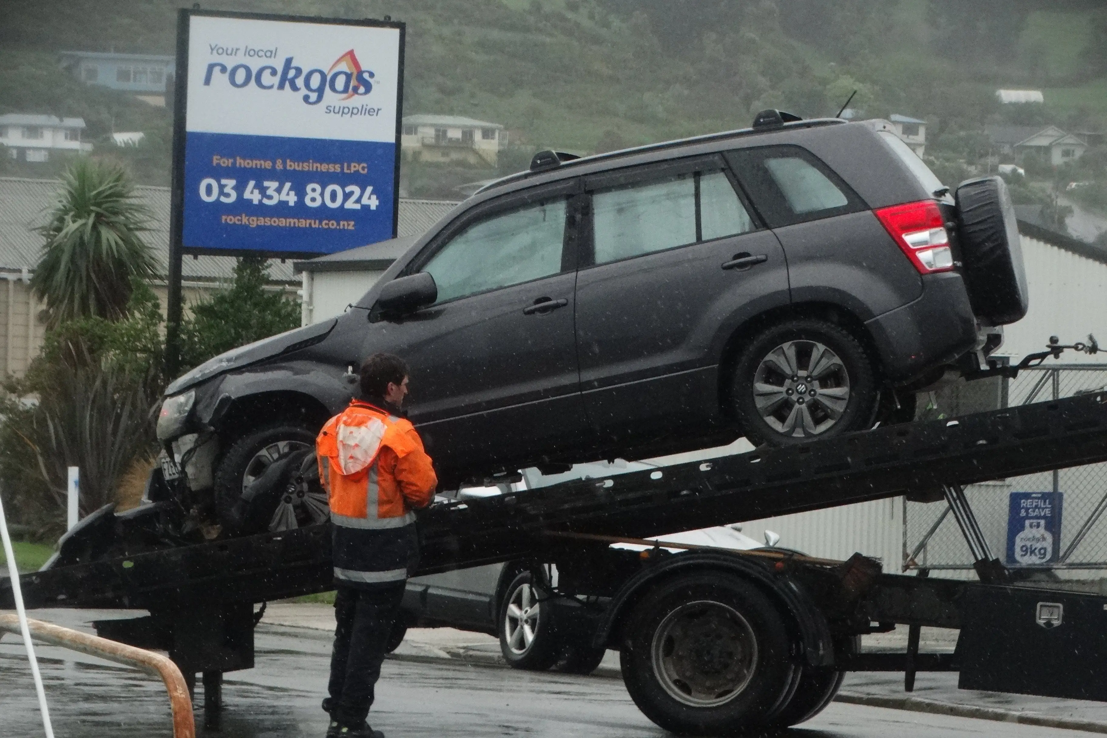 A vehicle flipped on to its side after crashing into a fence in Oamaru this morning. Photo: Nic Duff