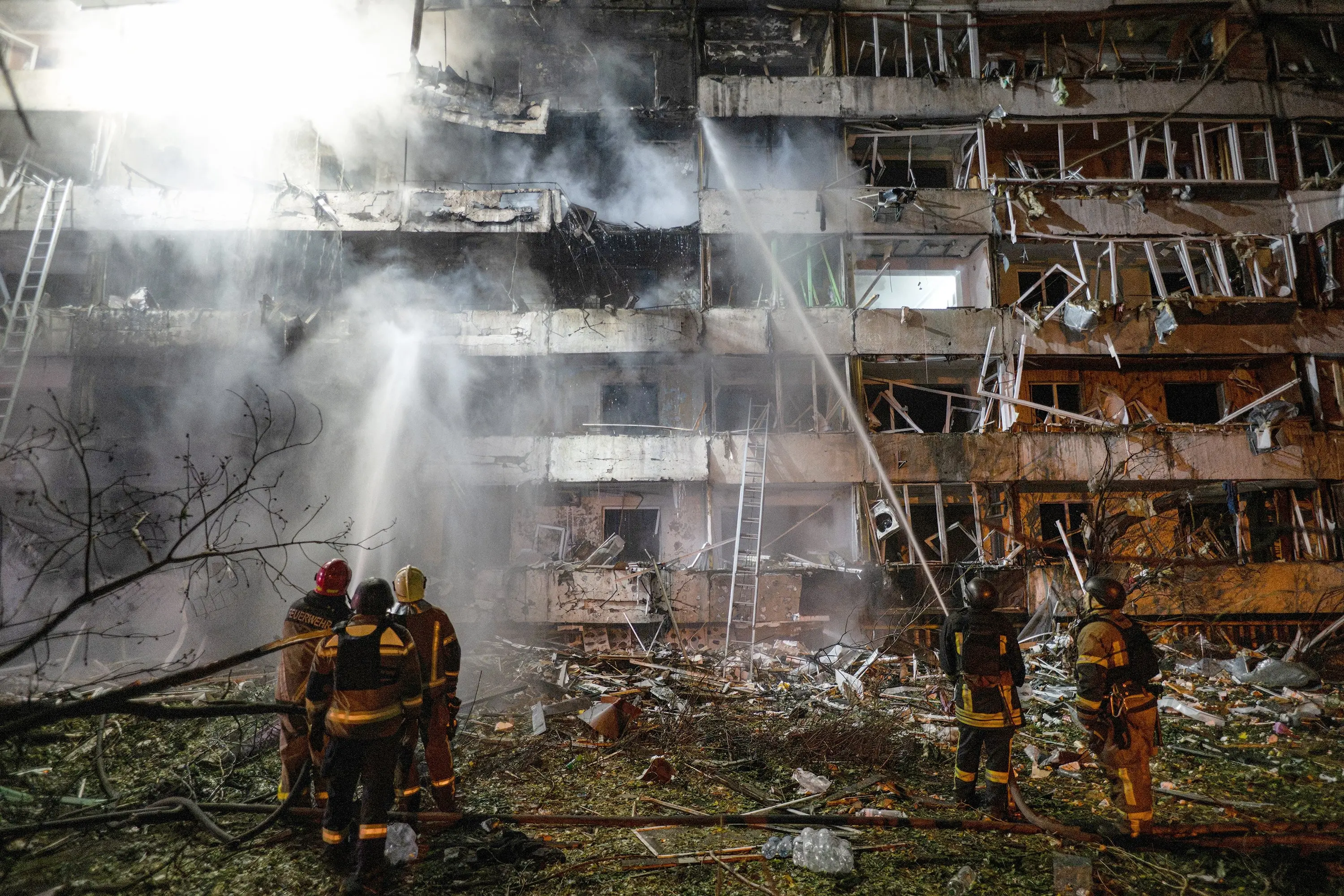 Ukrainian firefighters extinguish a blaze at the site of a Russian missile strike at an apartment building in Kyiv. Photo: Getty Images