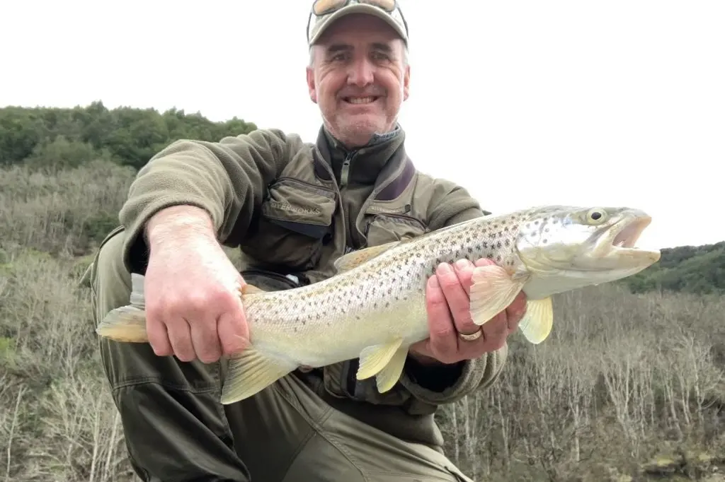 Shaun Yeo, of Winton, with a brown trout he caught at Nokomai on the upper Mataura River on the first day of the season in 2024. Photo: supplied