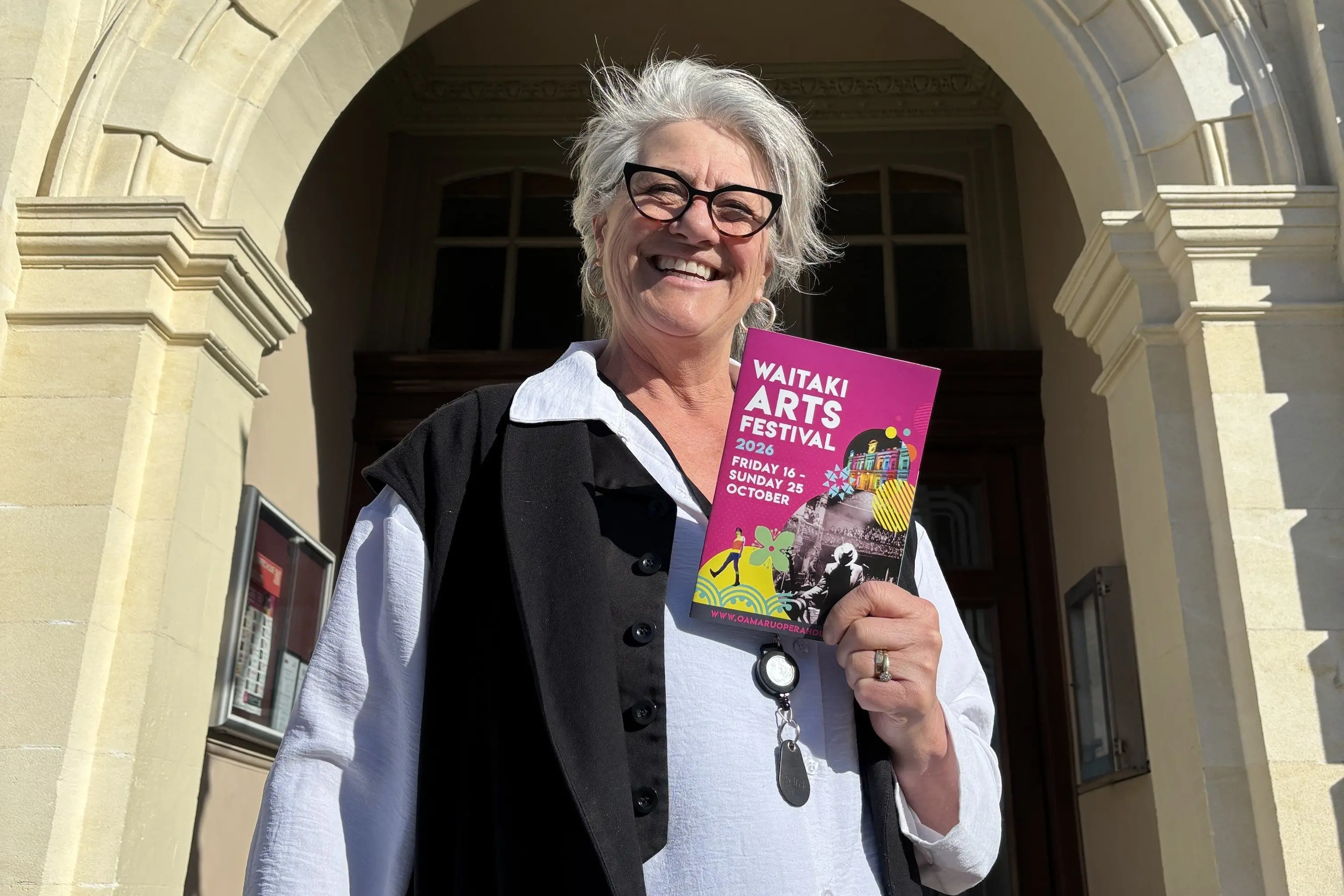 Oamaru Opera House manager and Waitaki Arts Festival coordinator Frances McElhinney holds the festival programme for 2026. Photo: Supplied