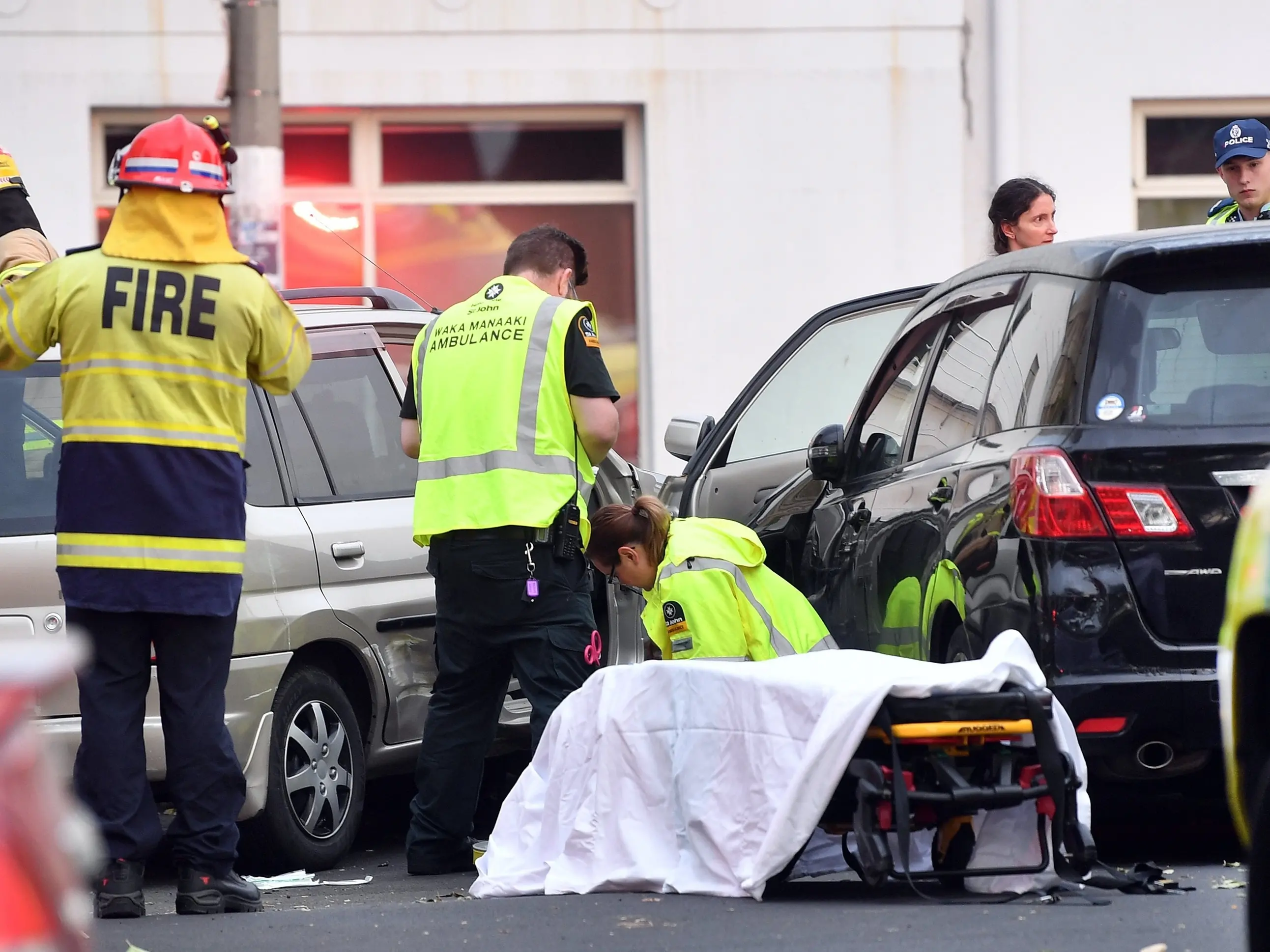 Seriously hurt Dunedin driver was pinned between two cars after falling out of vehicle while reversing