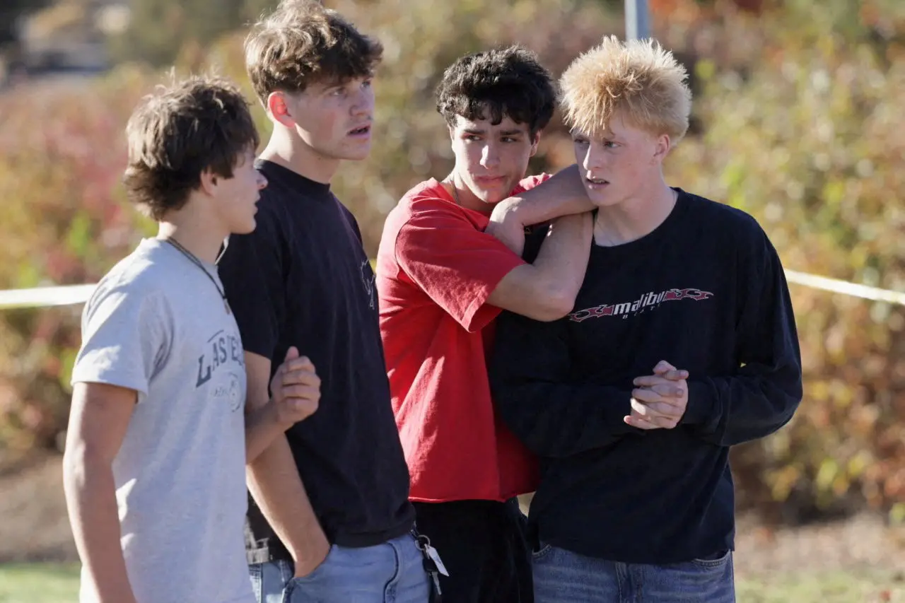 Students from Silver Rail Elementary School support each other after the fatal shootings. Photo: Reuters