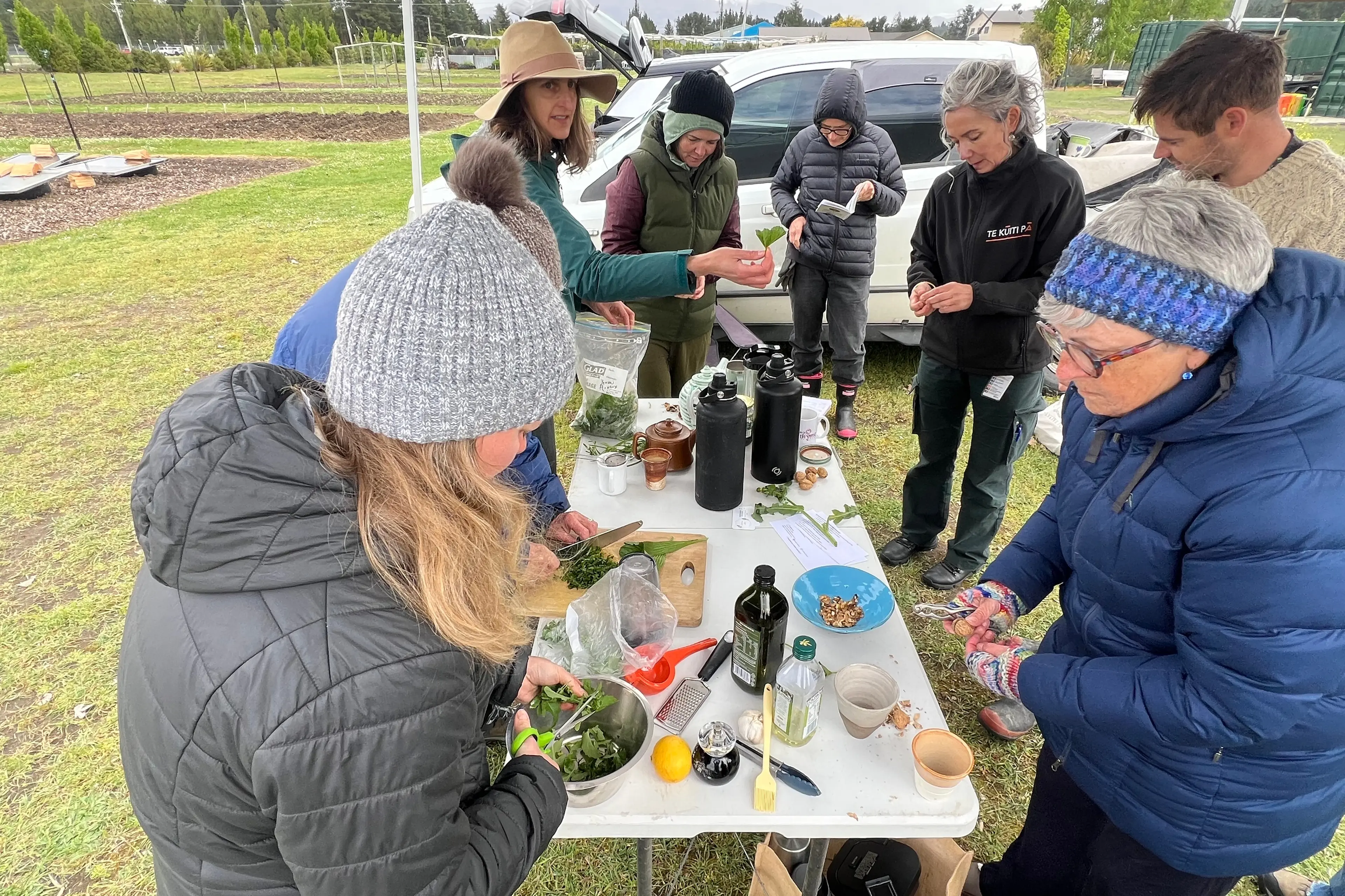 Medical herbalist Loran Verpillot leads the group in making pesto from scratch at REAP\\'s Forage and Harvest Workshop at the Alexandra Community Gardens. Photo: Carys Trotter