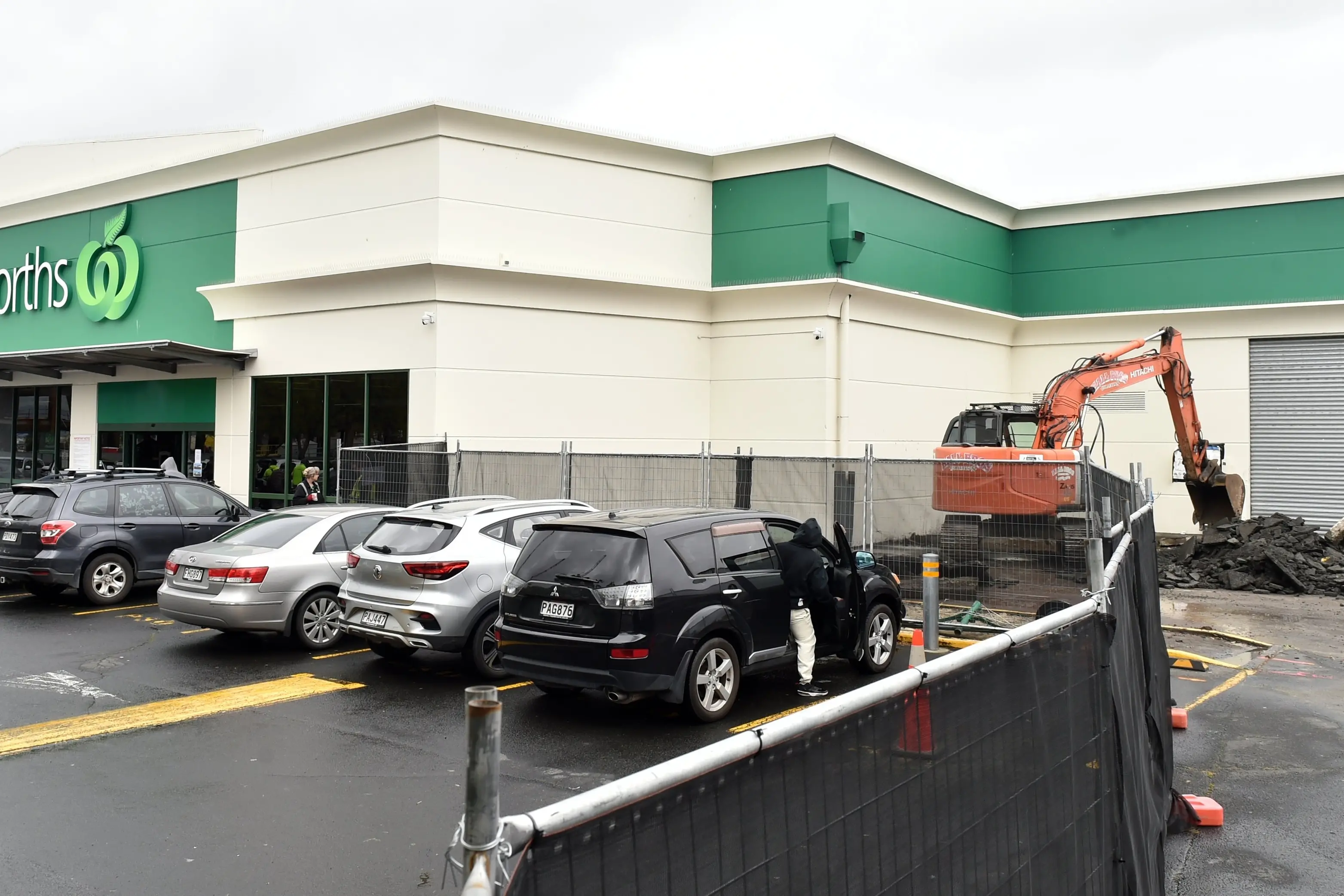 A digger gets to work ripping up concrete at Woolworths Dunedin Central as part of\\u00A0an expansion to accommodate online grocery orders. Photo: Peter McIntosh