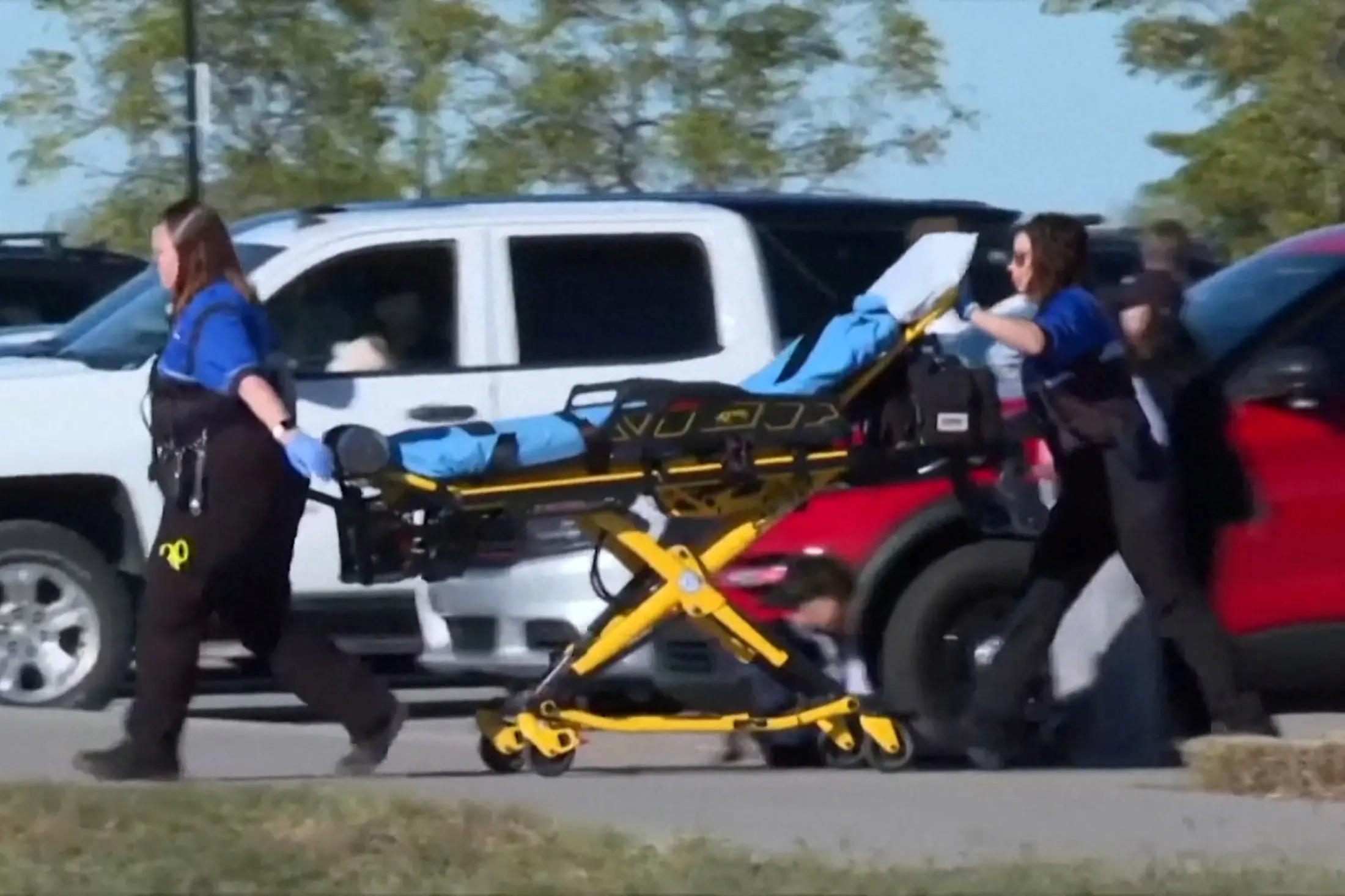 A stretcher is brought to the scene of the incident at the Stryker Sports Complex in Wichita. Photo: Reuters