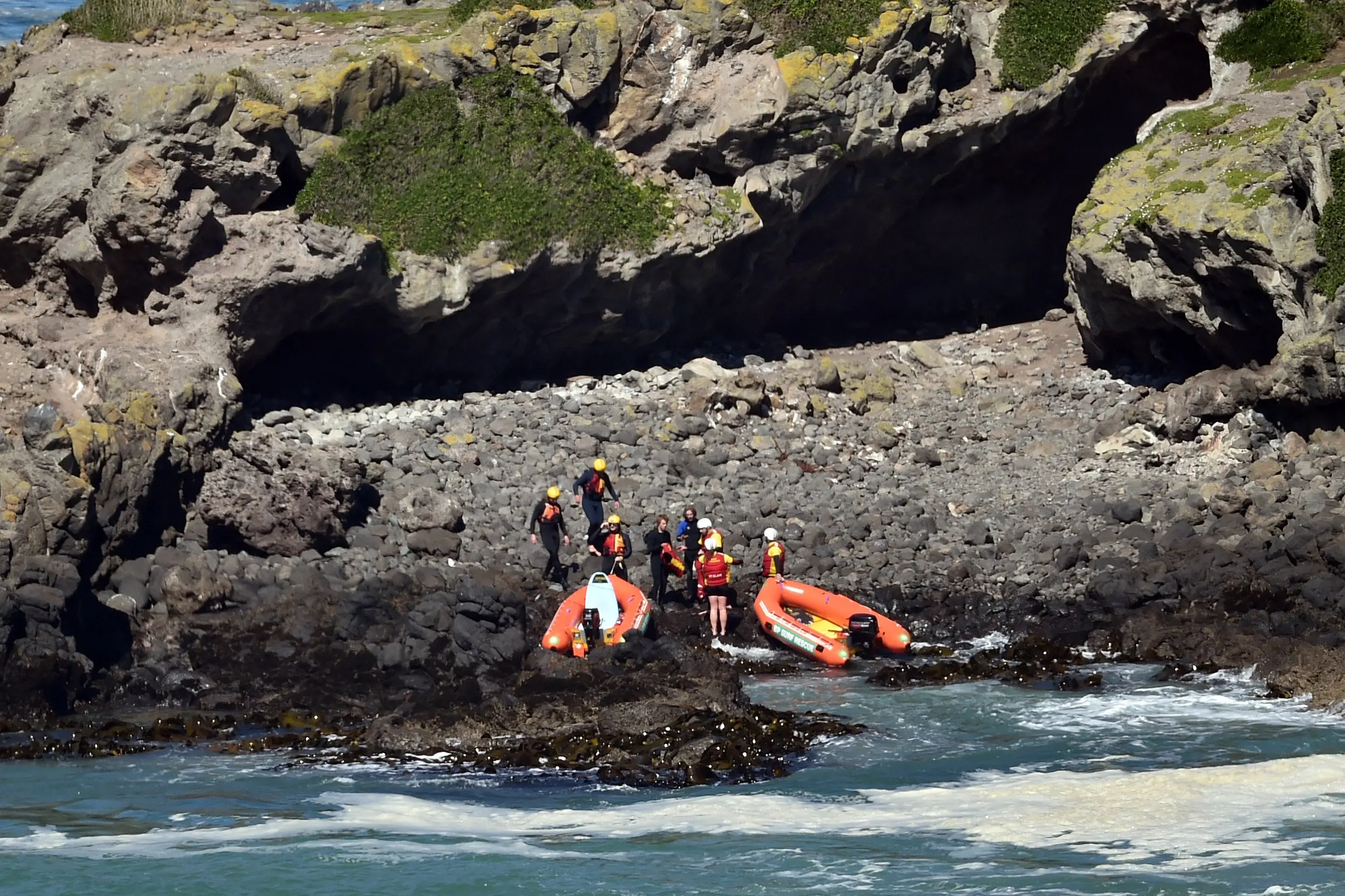 Inflatable rescue boats were used to help two surfers in trouble near Smaills Beach on Sunday. Photo: Gregor Richardson