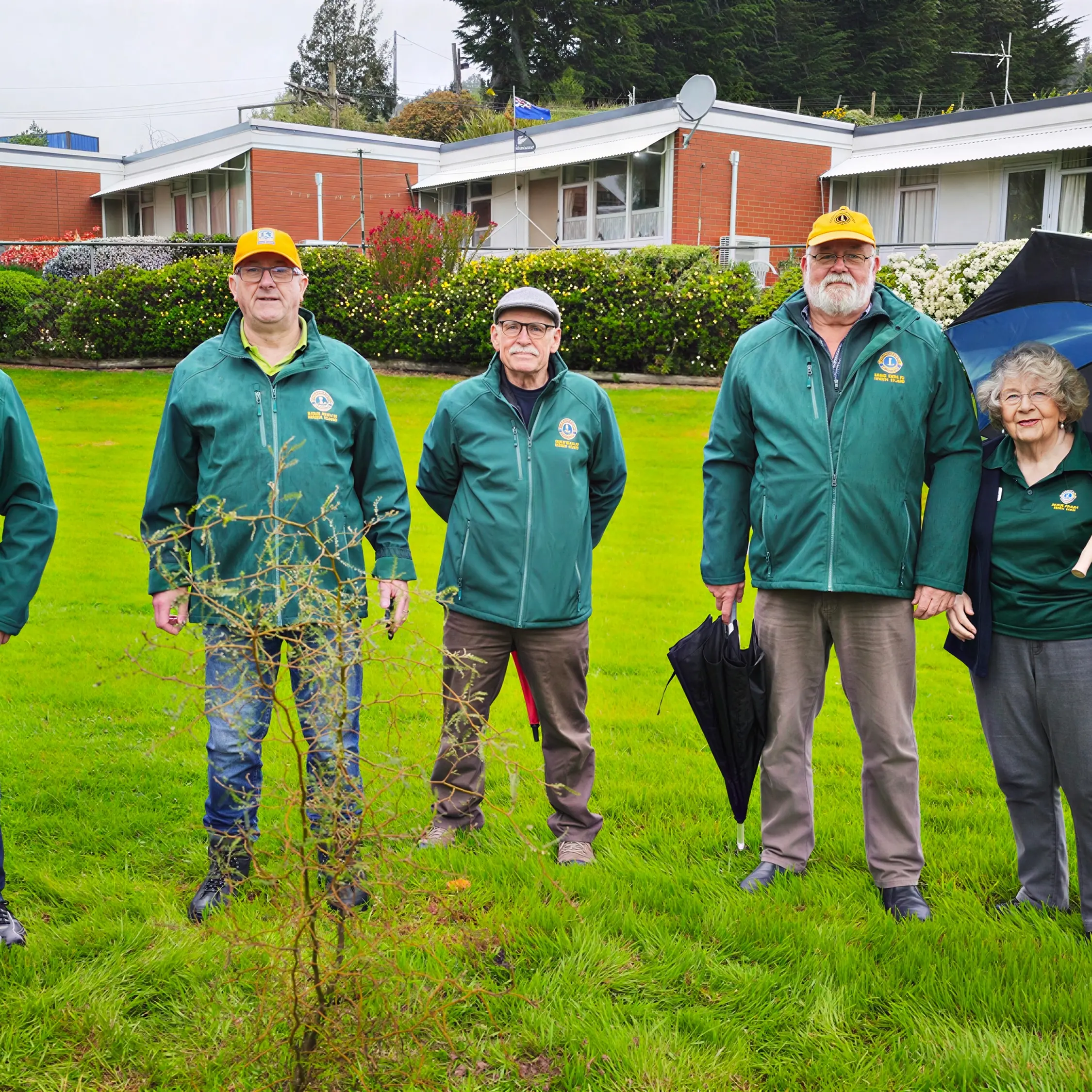 Green Island Lions leaders gather to plant gifted kōwhai in memory of past members