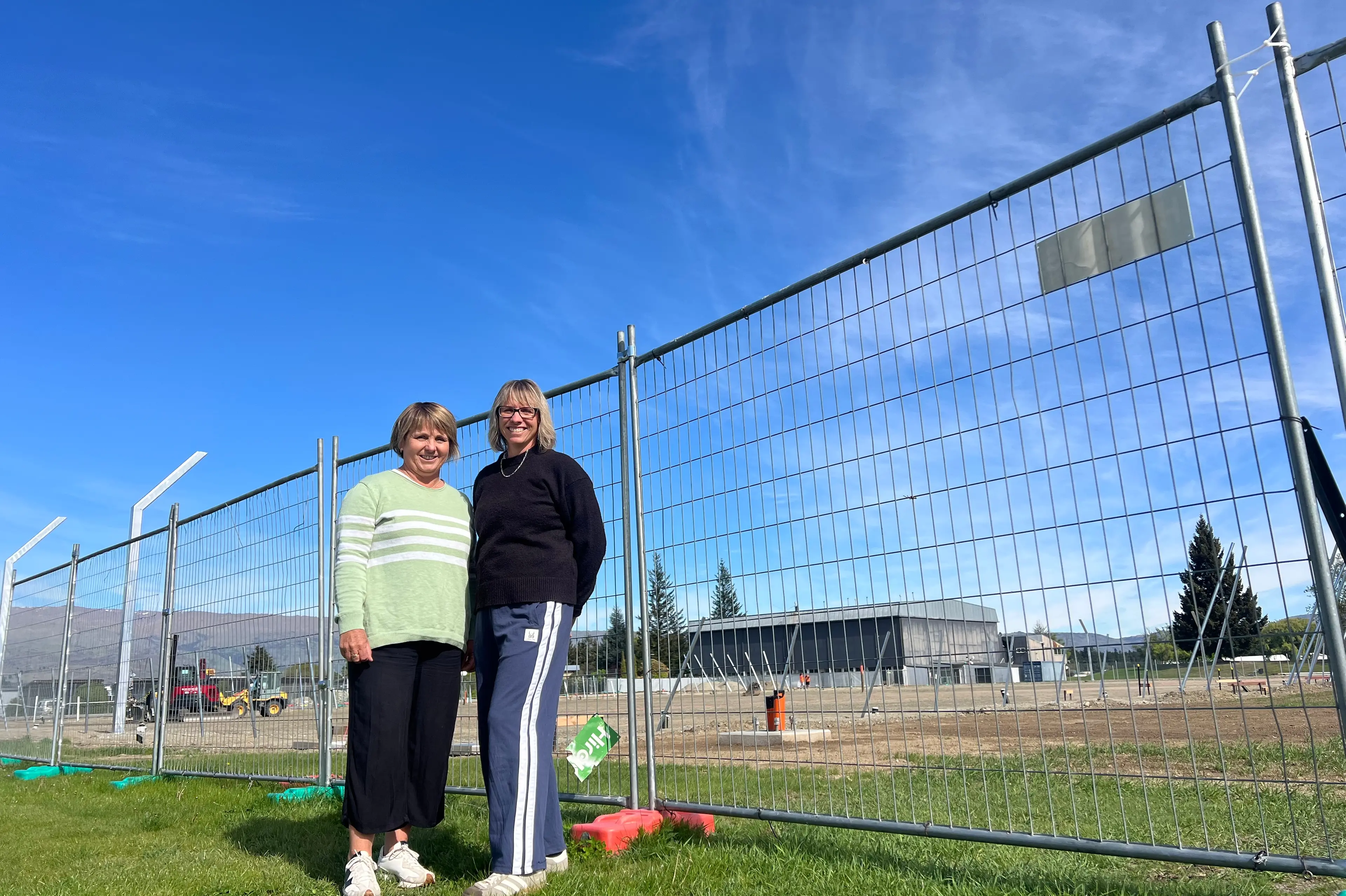 Dunstan High School director of sport Sally Mullally (left) and Maree Denniston, who helps lead funding and promotions for the project, standing at the site of the new Molyneux Turf under construction at the school. Photo: Carys Trotter