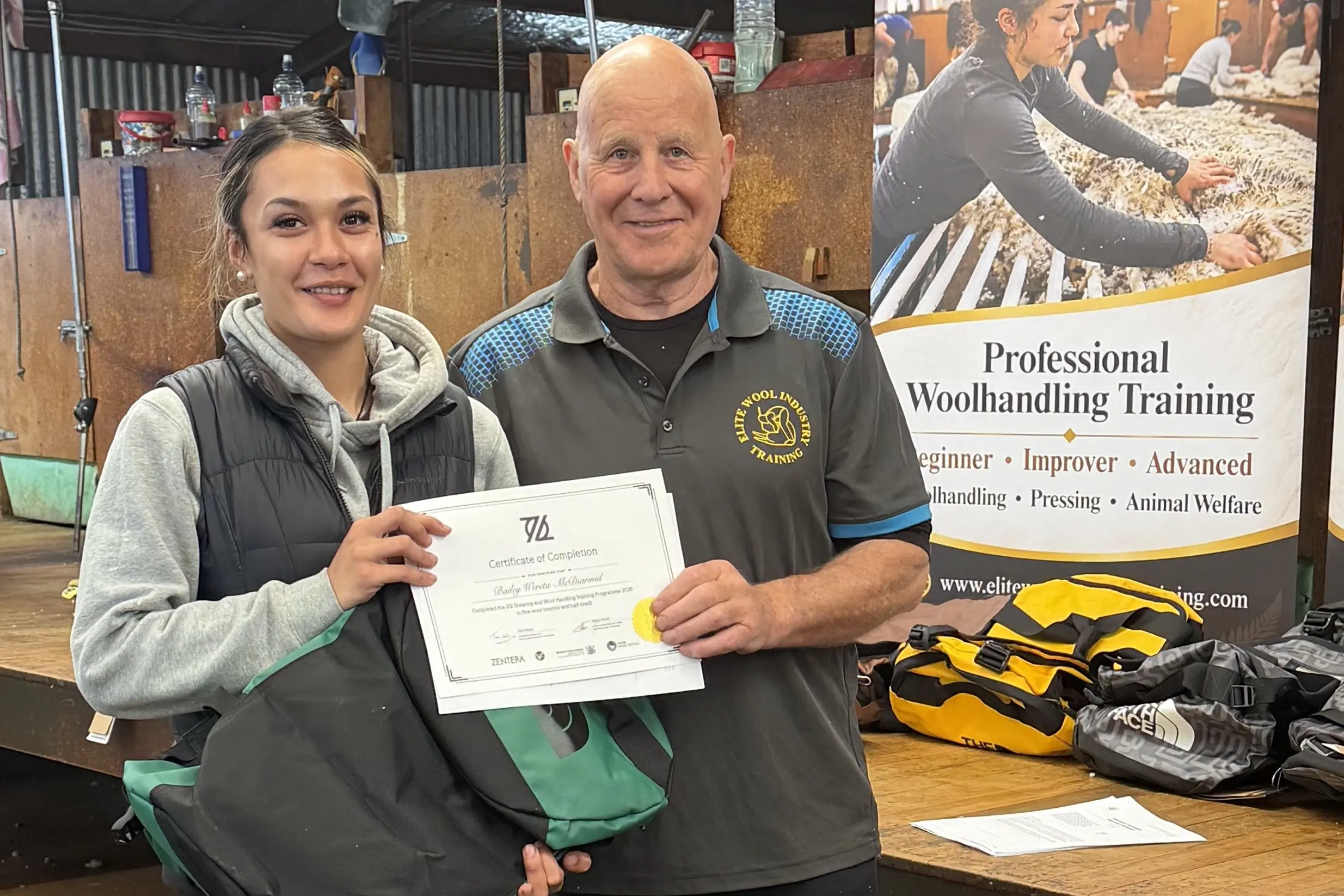 Bailey Wereta-McDiarmid, left,\\u00A0and Elite Wool Industry Training chief executive Tom Wilson after she completed the ZQ Shearing and Wool Handling Training Programme. Photo: Supplied