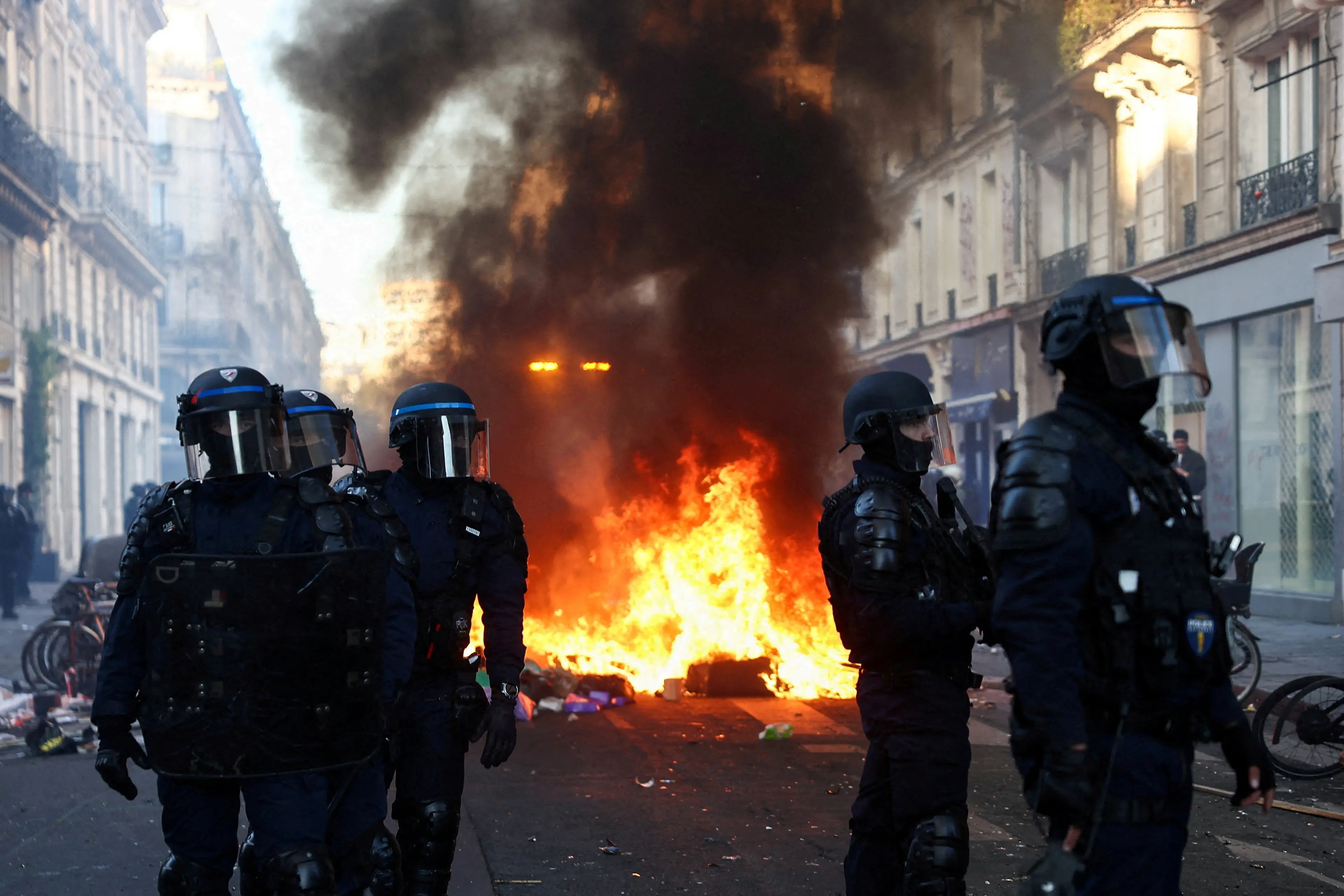 Police in riot gear stand guard during civil unrest in Paris as demonstrations against the cost of living and rising fuel prices continue. Photo: Reuters