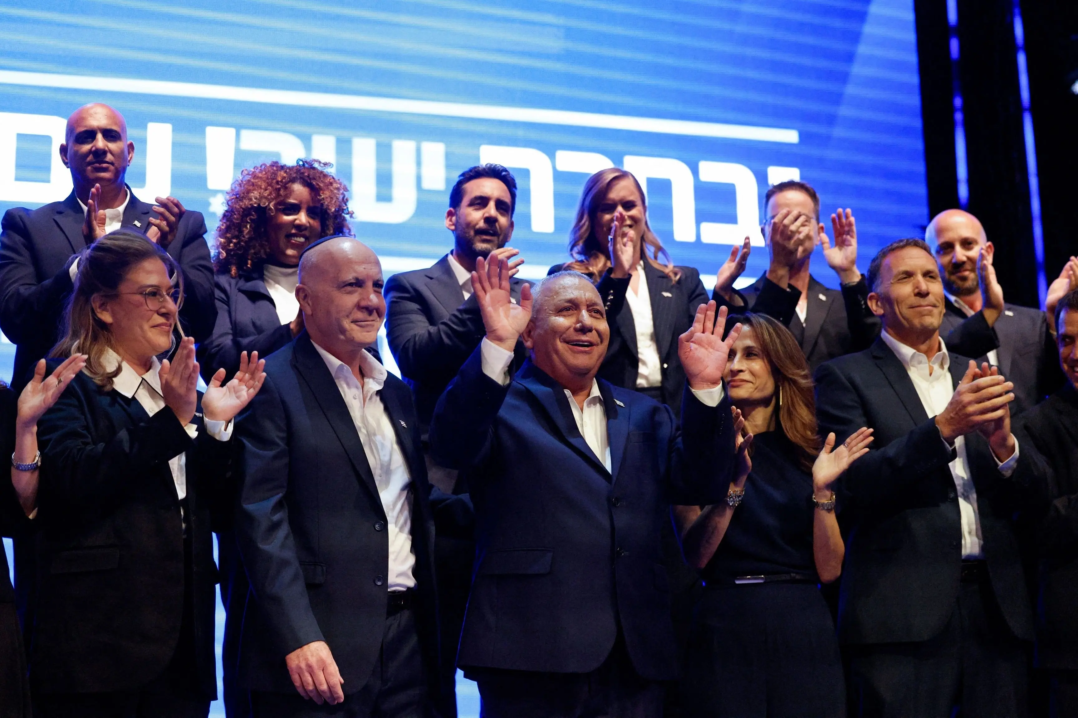 Israeli opposition leader and former military chief Gadi Eisenkot (ventre, hands raised) at an event to present the candidate list for his political party, Yashar. Photo: Reuters