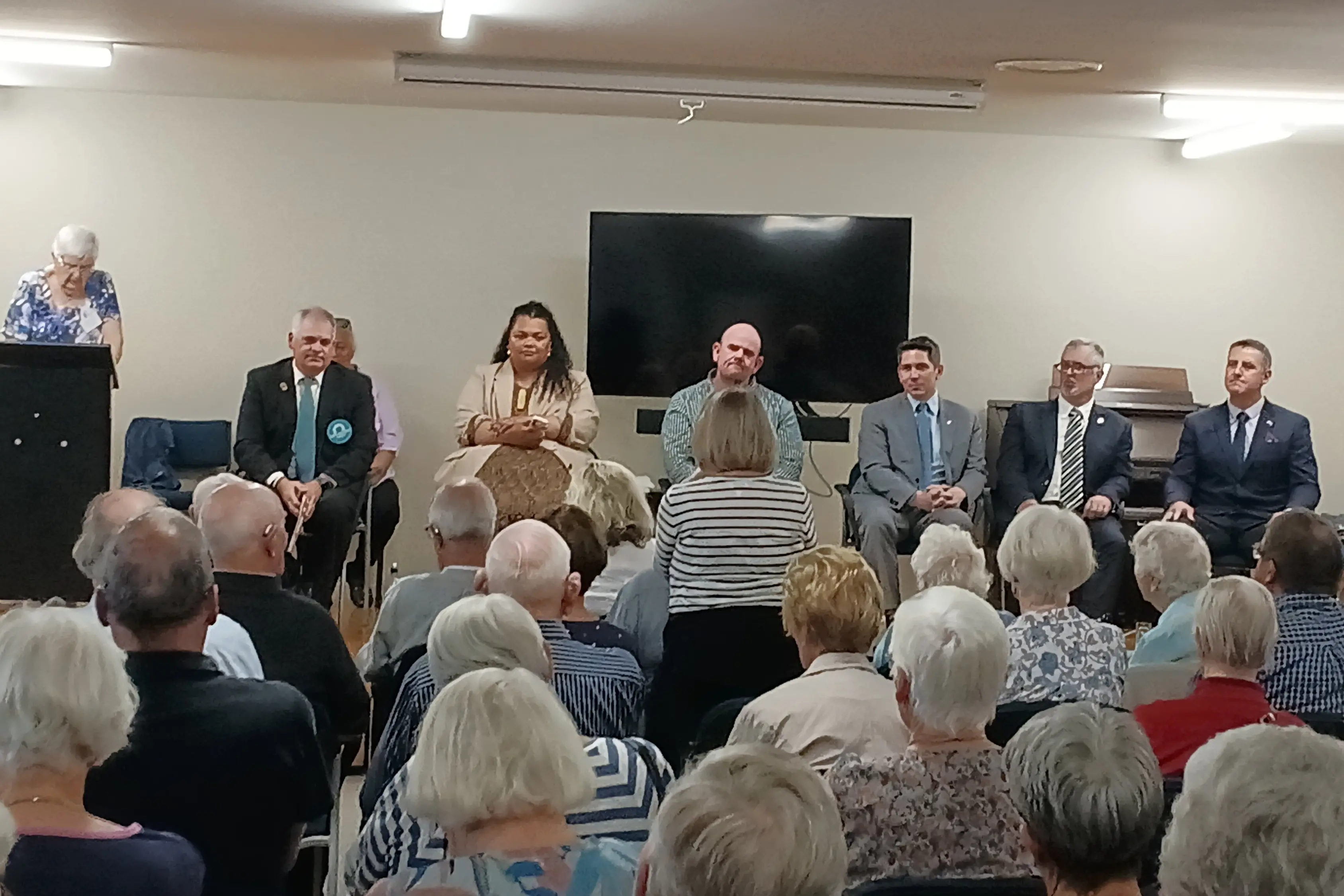 Grey Power Ashburton president Cath Carr mcees the meet the candidate event featuring from left, Matt Harris (Opportunity), Sange Malama (Labour), Dave Richards (Green), James Meager (National), Isacc Nicholson (NZ First) and Karl Thomas (Conservative). Absent was Aaron Allred (ACT) who put in his apologies and Kevin McCracken (NZ Outdoors and Freedom). Photo: Toni Williams