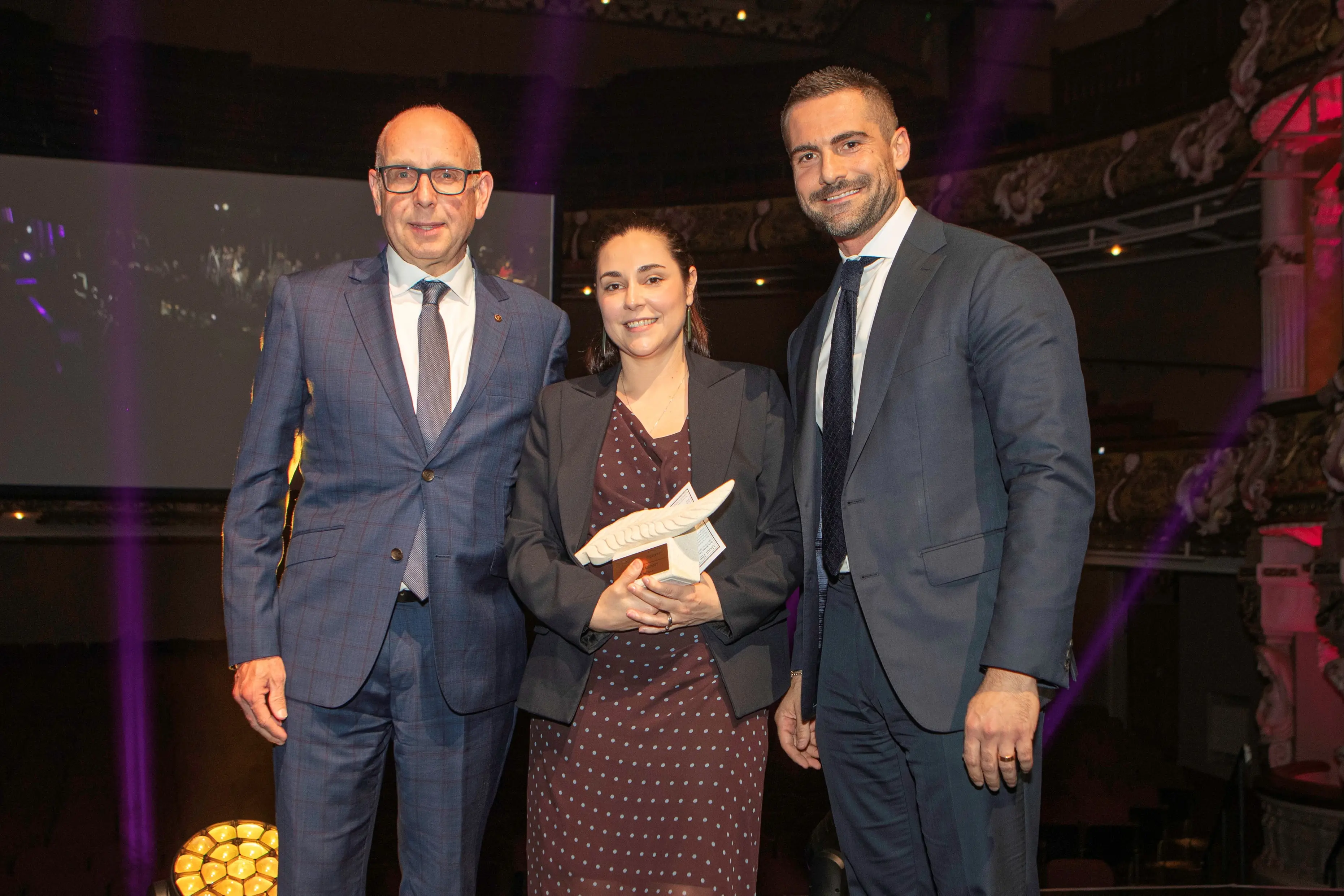 A cut above: Queenstown Airport aviation and customer chief, left, and customer head Vanessa Hartnell pictured with Assetlink GM Giuliano Fonte in Wellington on Tuesday night. Photo: Supplied