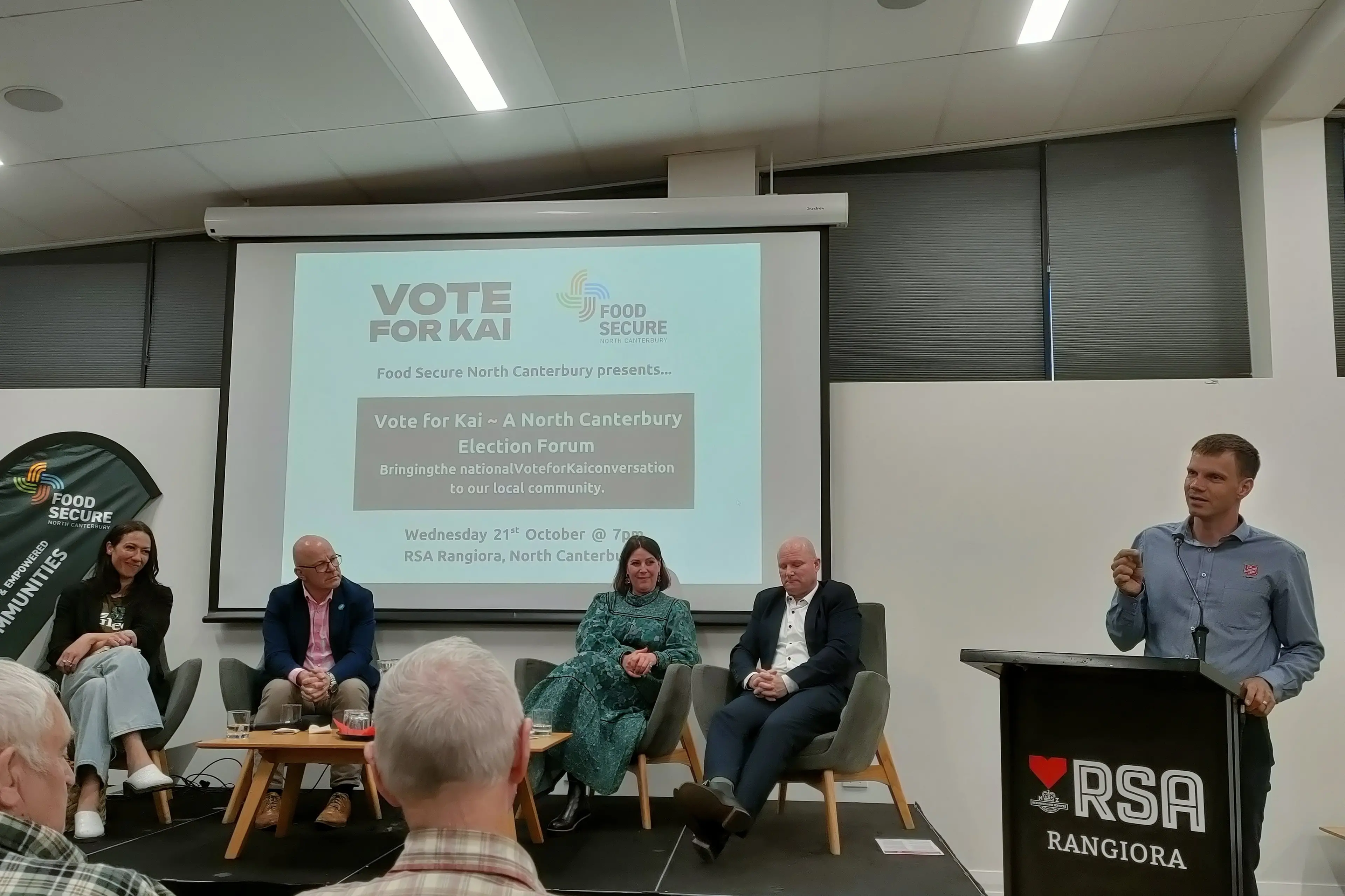 Food security . . . Salvation Army North Canterbury Lieutenant Barry Kirby (right) addresses candidates Kahurangi Carter (Greens, left), Matt Doocey (National), Elizabeth Mundt (New Zealand First) and Dan Rosewarne (Labour) at a Vote for Kai election meeting at the Rangiora RSA Club. Photo: David Hill
