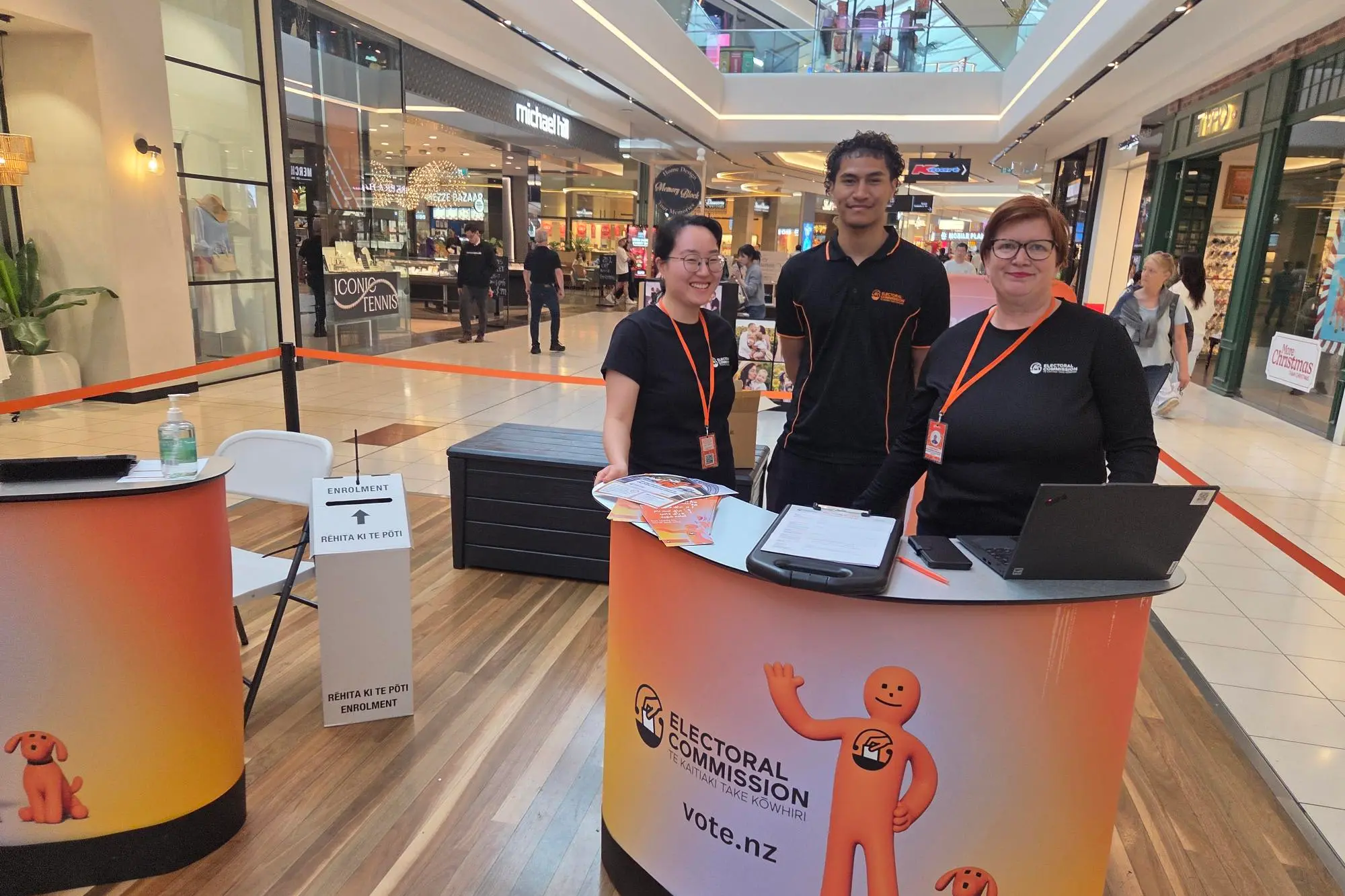 Electoral Commission workers Yebin Hong, Jeremiah Tuuaga and Hannah Edward at the Sylvia Park enrolment hub. Photo: RNZ