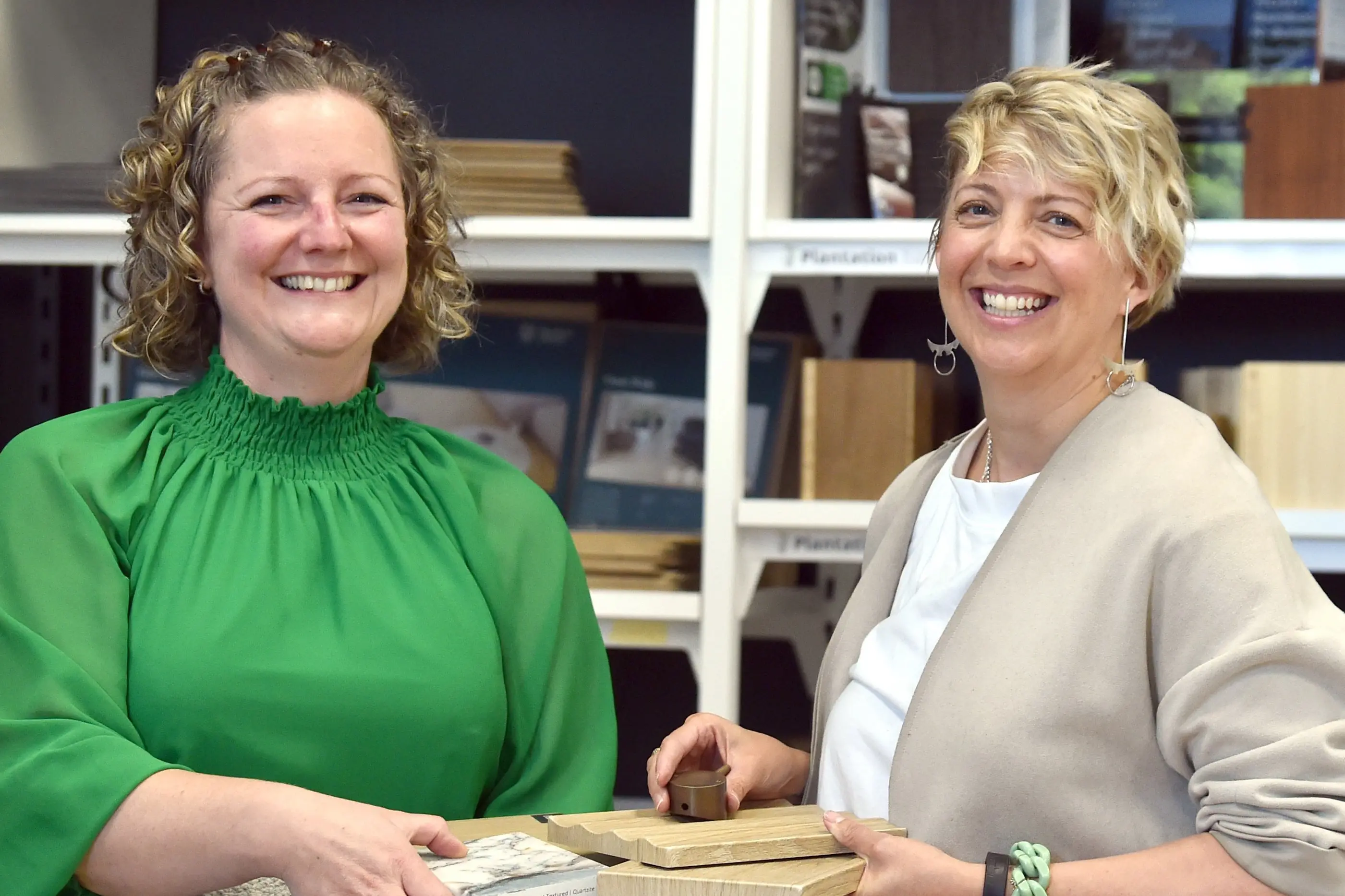 Architecture + Design Library co-founders Penny Calder (left) and Verity Lawrence hold some of the many different product samples used in the construction industry that are available at their Wharf St \"library\". Photo: Peter McIntosh