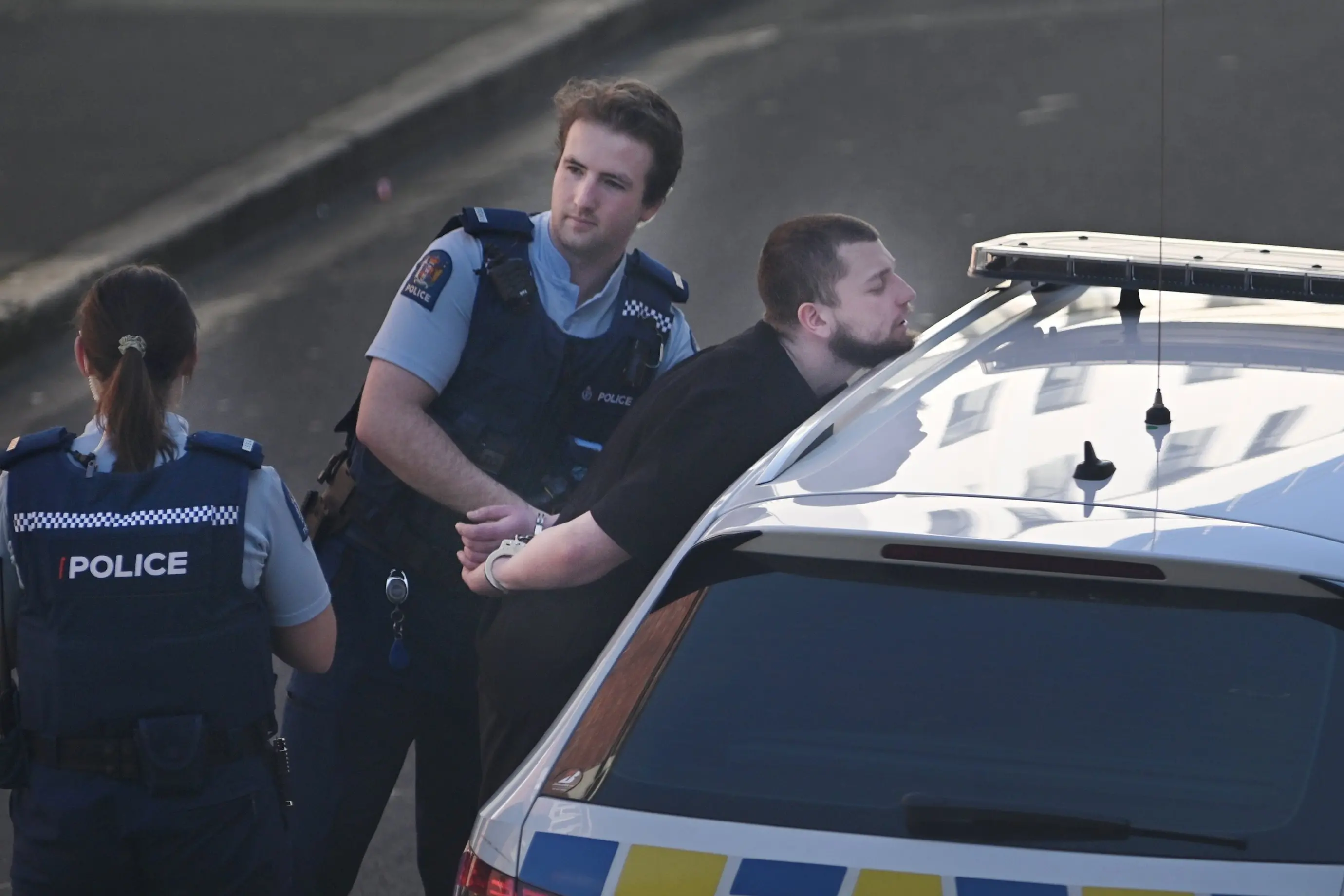 Zane Clarke is arrested outside the Dunedin courthouse in Dunbar St in September. Photo: Staff Photographer