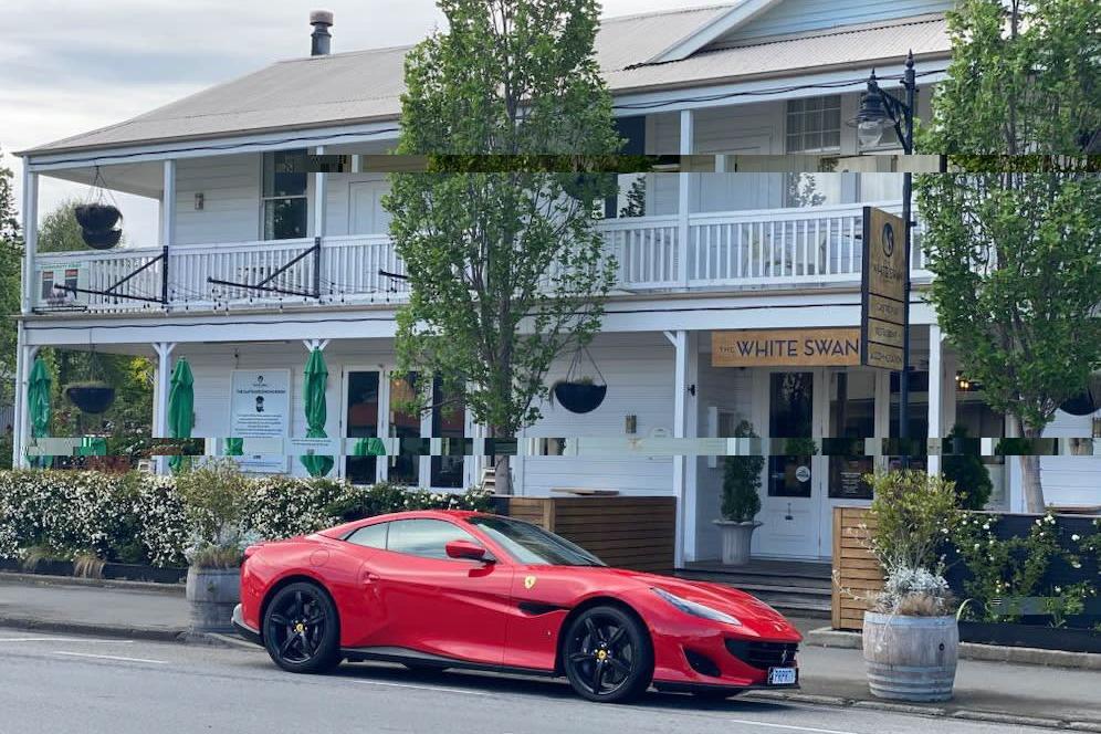 Luxury car dealer rumoured to be overseas as business shuts abruptly