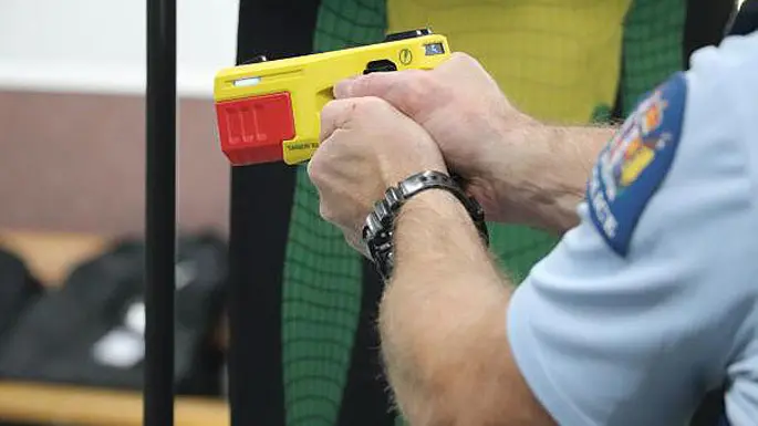 'Come at me then': Taser fails to bring down man brandishing knife at police