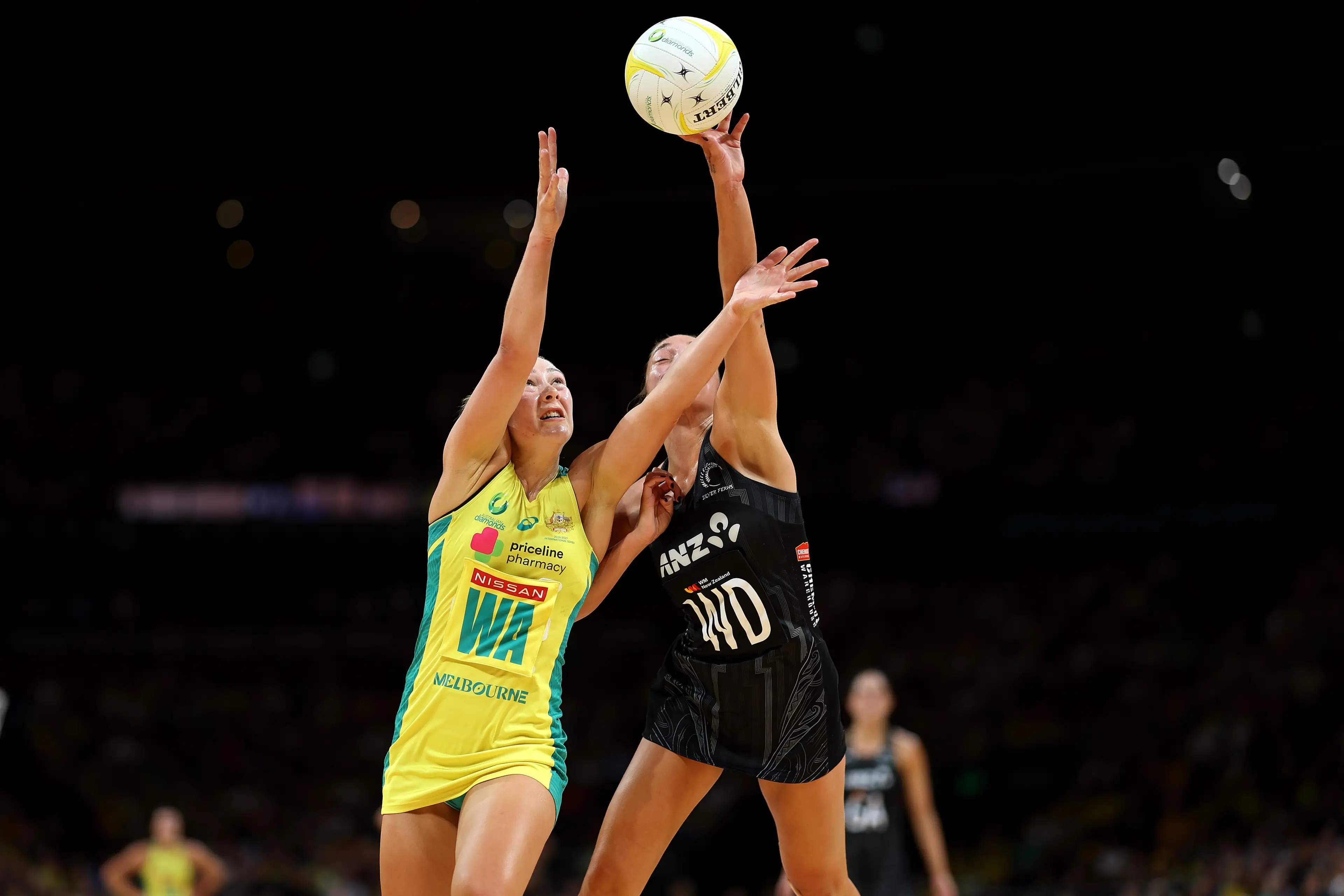 Australia wing attack Georgie Horjus and Silver Ferns wing defence Mila Reuelu-Buchanan battle for the ball during test three in Sydney on Sunday. Photo: Getty Images