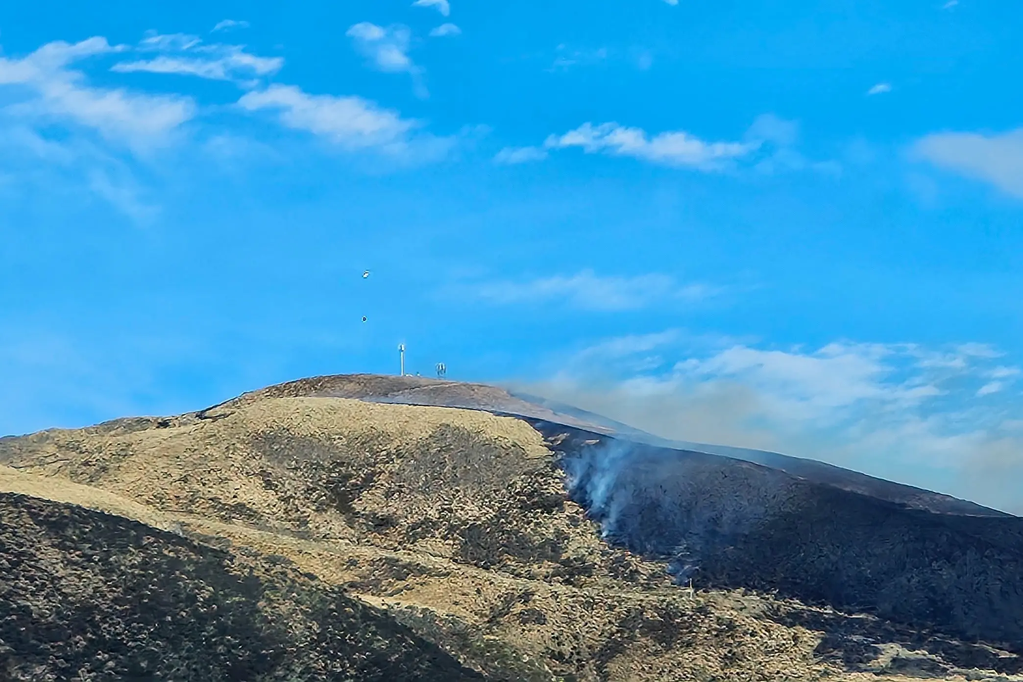 The vegetation fire at Centre Hill is threatening two telecommunication towers. Photo: Fenz