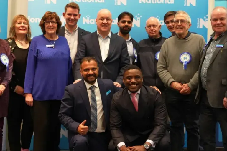 <p>National leader Christopher Luxon and electorate committee member Roger Buchanan (far right). Photo: Supplied</p>\\n