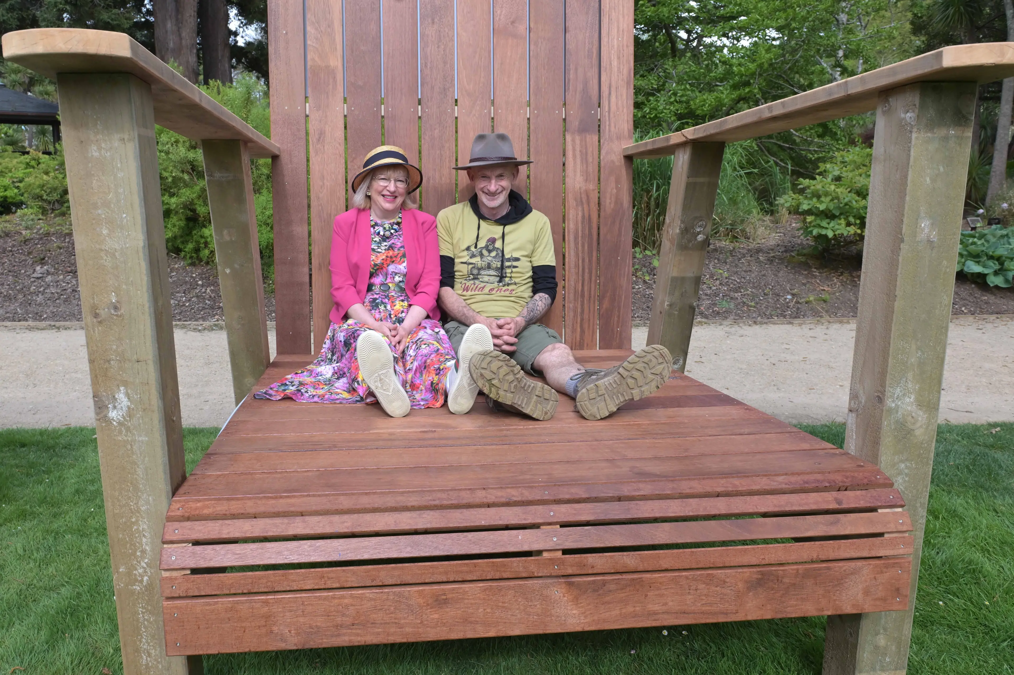 Dunedin Mayor Sophie Barker and Rodney McDonald, of Dunedin, look at life on the small side, from the giant chair at the Garden Otepoti Dunedin family picnic day at the Botanic Garden on Monday. Photo: Gerard O\\'Brien