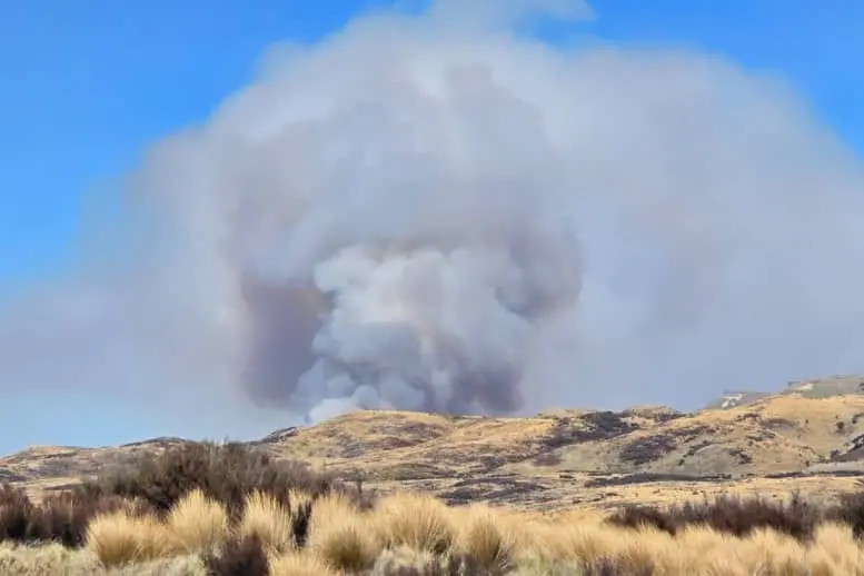 A large smoke plume could be seen rising over the tussocky Central Plateau landscape near Waiouru on Monday afternoon. Photo: Supplied/ Sarah Moodie