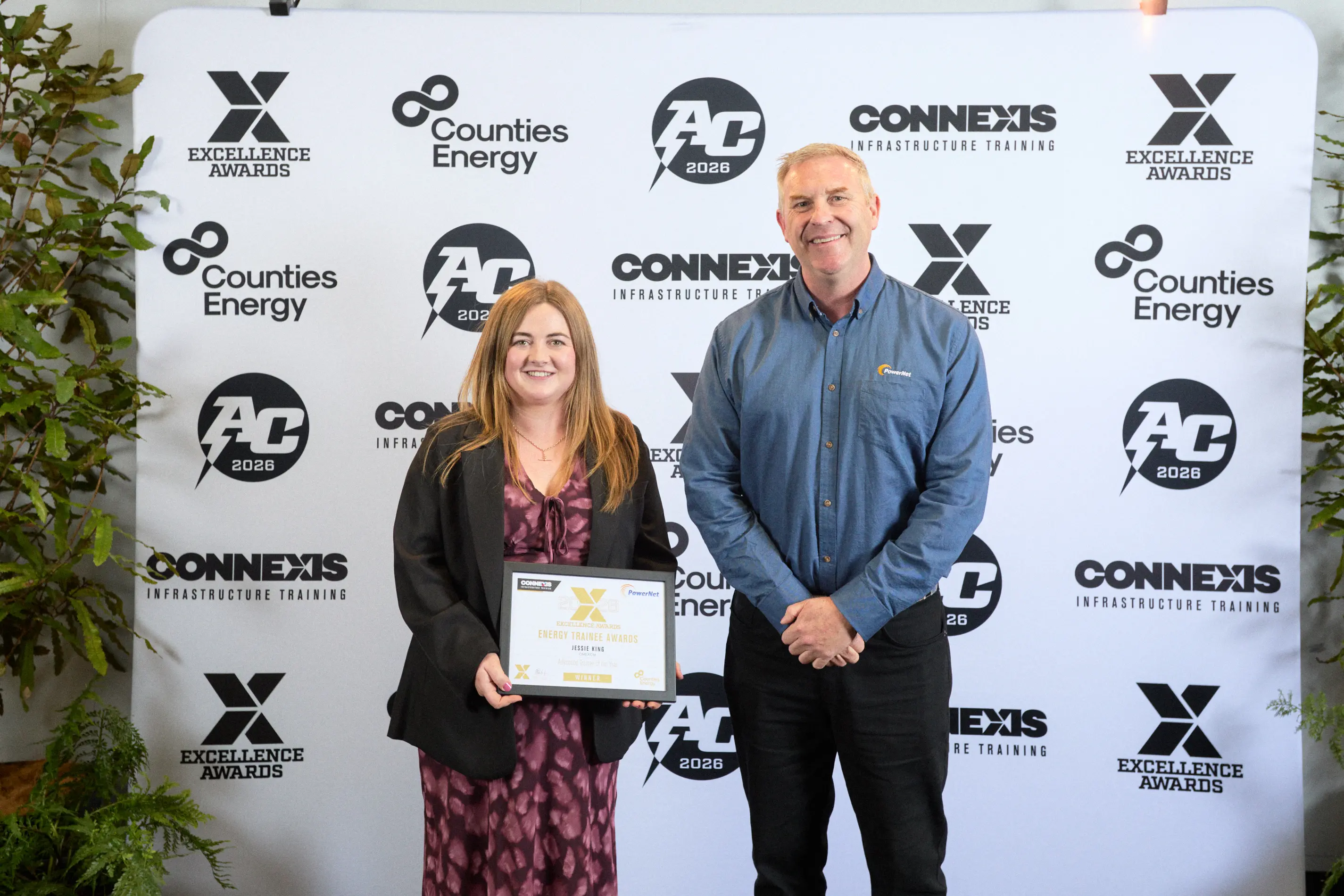 Invercargill power technician Jessie King receives her advanced trainee award from PowerNet chief executive Paul Blue. Photo: supplied