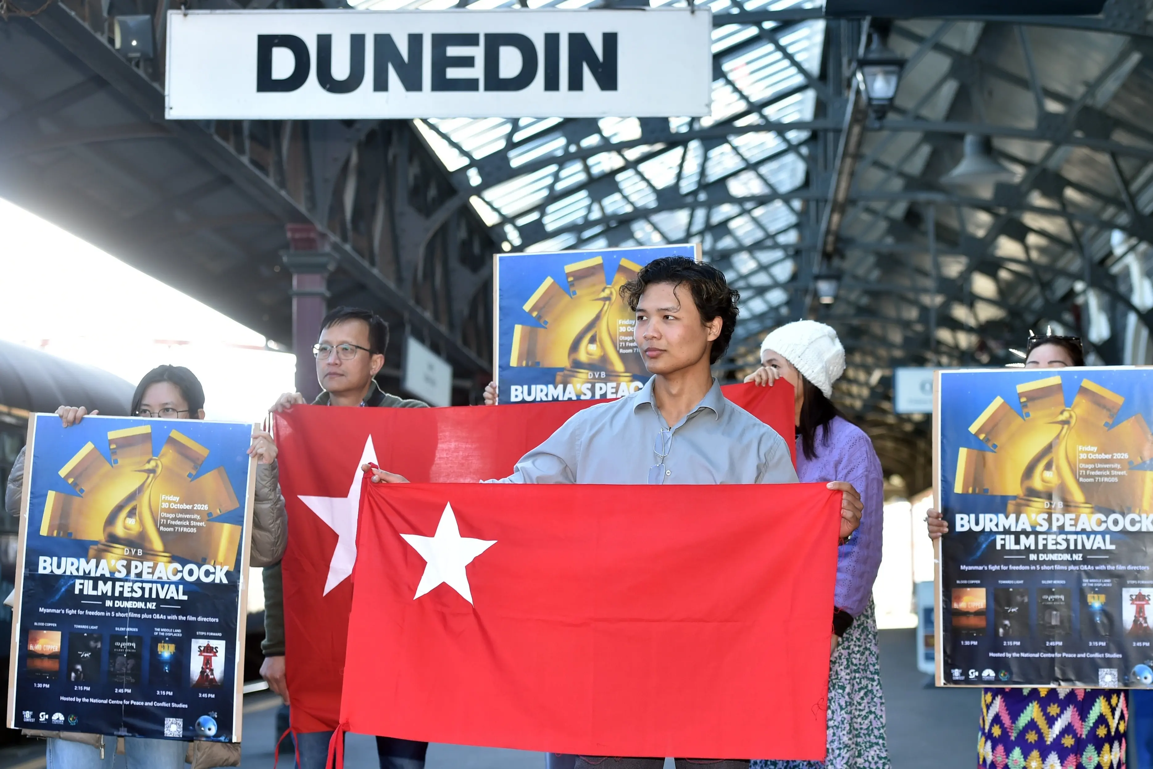 Pyay Oo, front,  with other members of the Dunedin Myanmar community at the Dunedin Railway Station highlighting thier upcoming film event. Photo: Gregor Richardson
