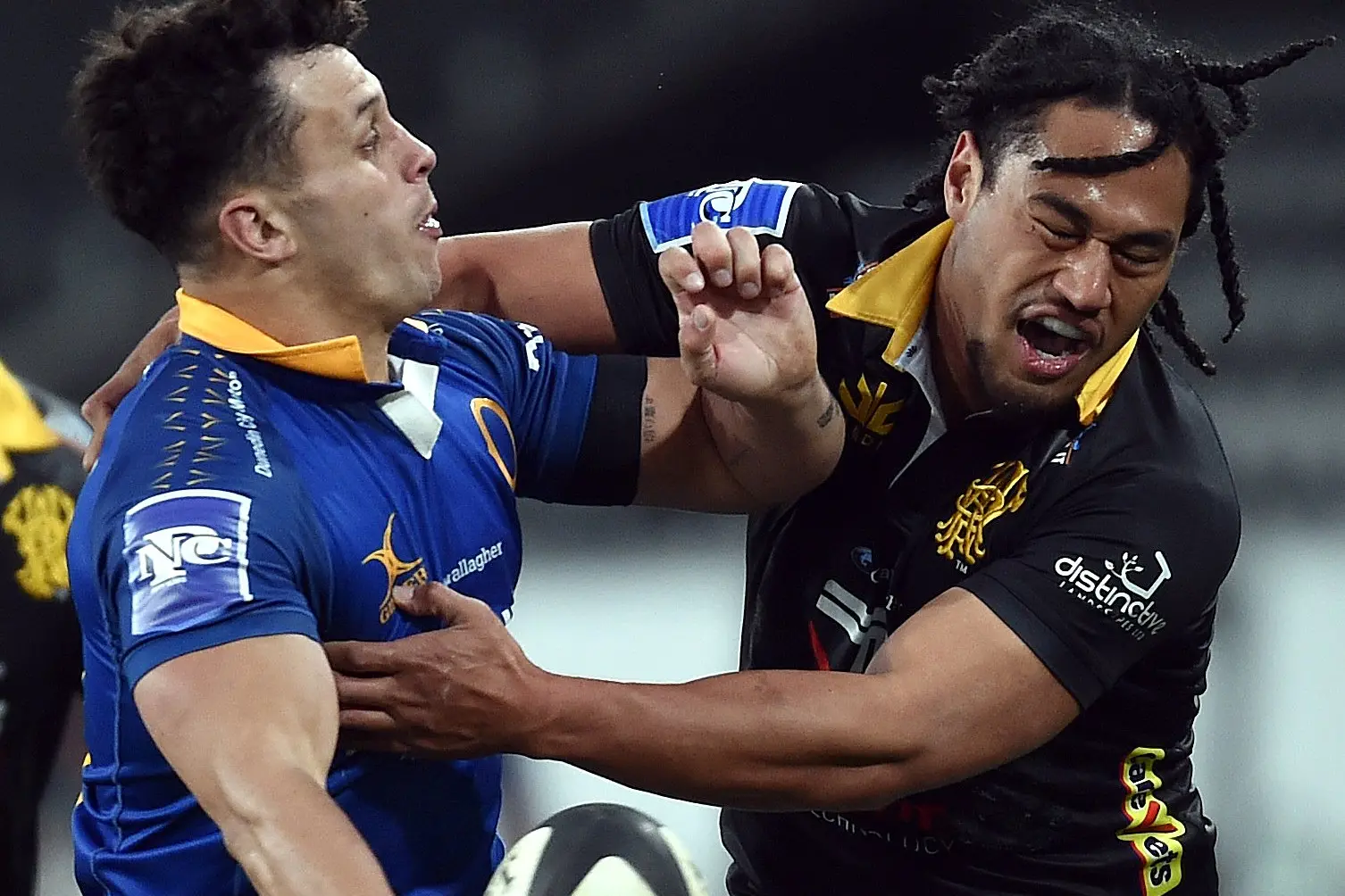 Otago midfielder Jake Te Hiwi looks to offload the ball as he is tackled by Wellington winger Isi Saumaki during the NPC game at Forsyth Barr Stadium earlier this season. Photo: Peter McIntosh