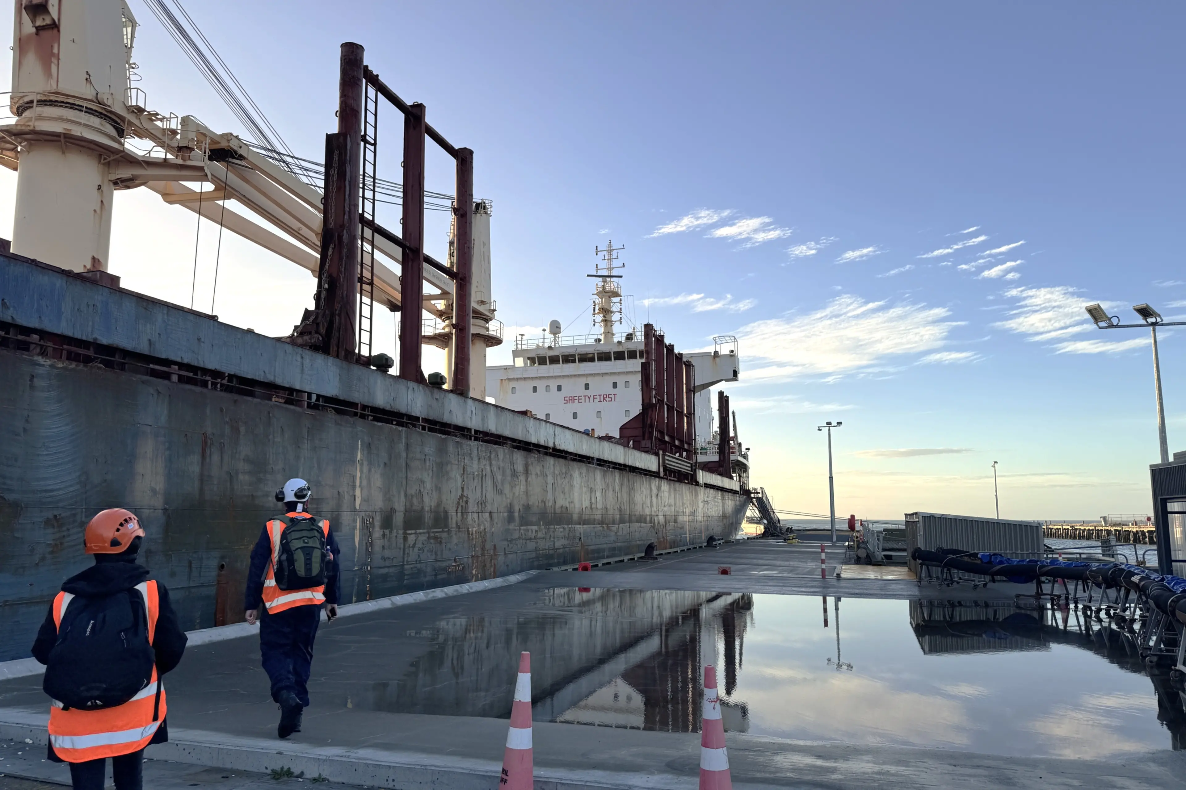 Transport Accident Investigation Commission investigators arrive in May at <i>Olivia</i>, docked at Bluff, to begin their inquiry into the accident. Photo: TAIC