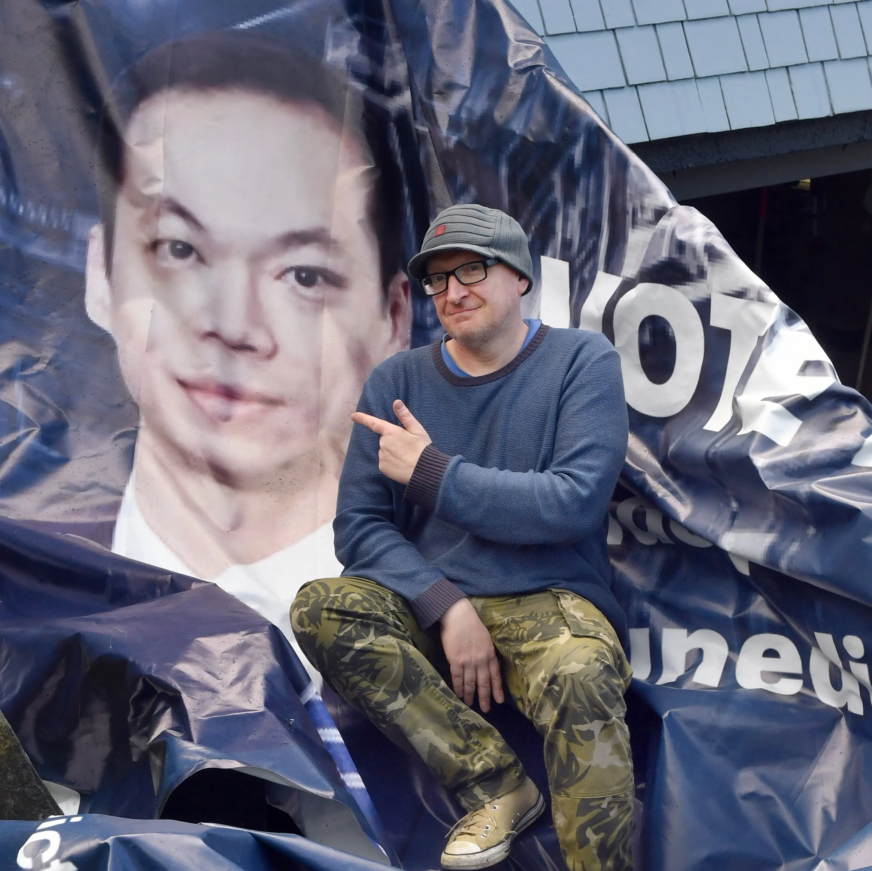 Artist gets Ong-spired after being slapped in the face by a massive flying political billboard