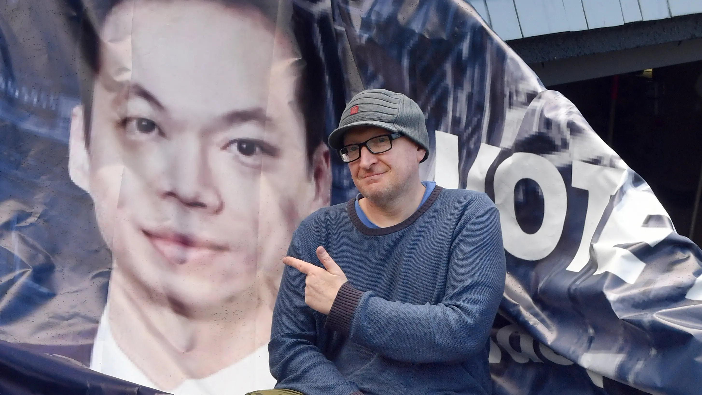 Artist gets Ong-spired after being slapped in the face by a massive flying political billboard